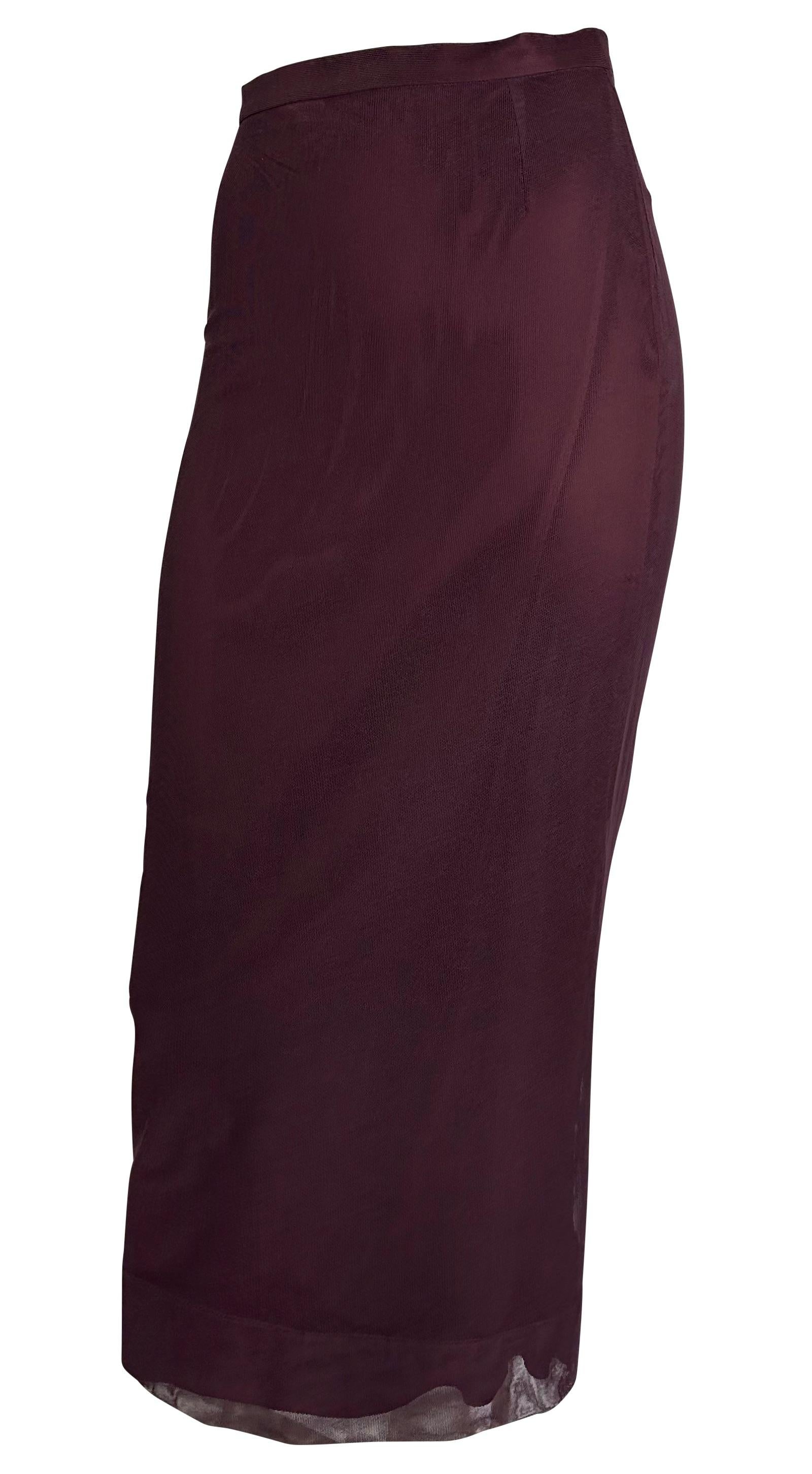 Presenting a beautiful burgundy Dolce and Gabbana mesh maxi skirt. From the Spring/Summer 1998 collection, this fabulous maxi skirt features a high waist with a mesh overlay. Effortlessly chic, this vintage skirt is the perfect on-trend piece to add