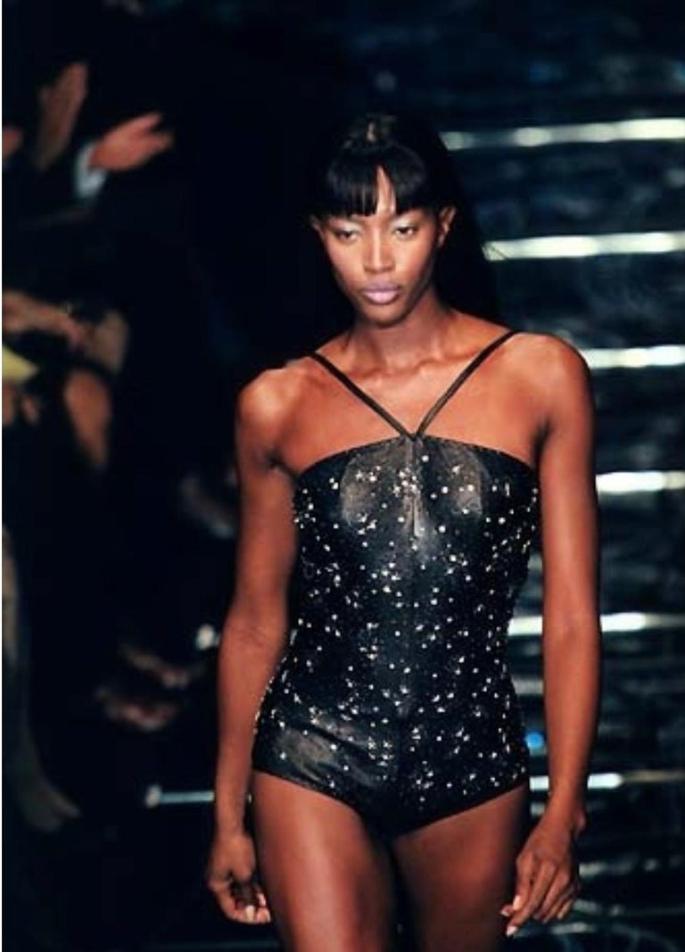 TheRealList presents: an absolutely amazing leather beaded Gianni Versace bodysuit, designed by Donatella Versace. From the Spring/Summer 1998 collection, this piece debuted on the season's runway on Naomi Campbell. This incredible one-piece was