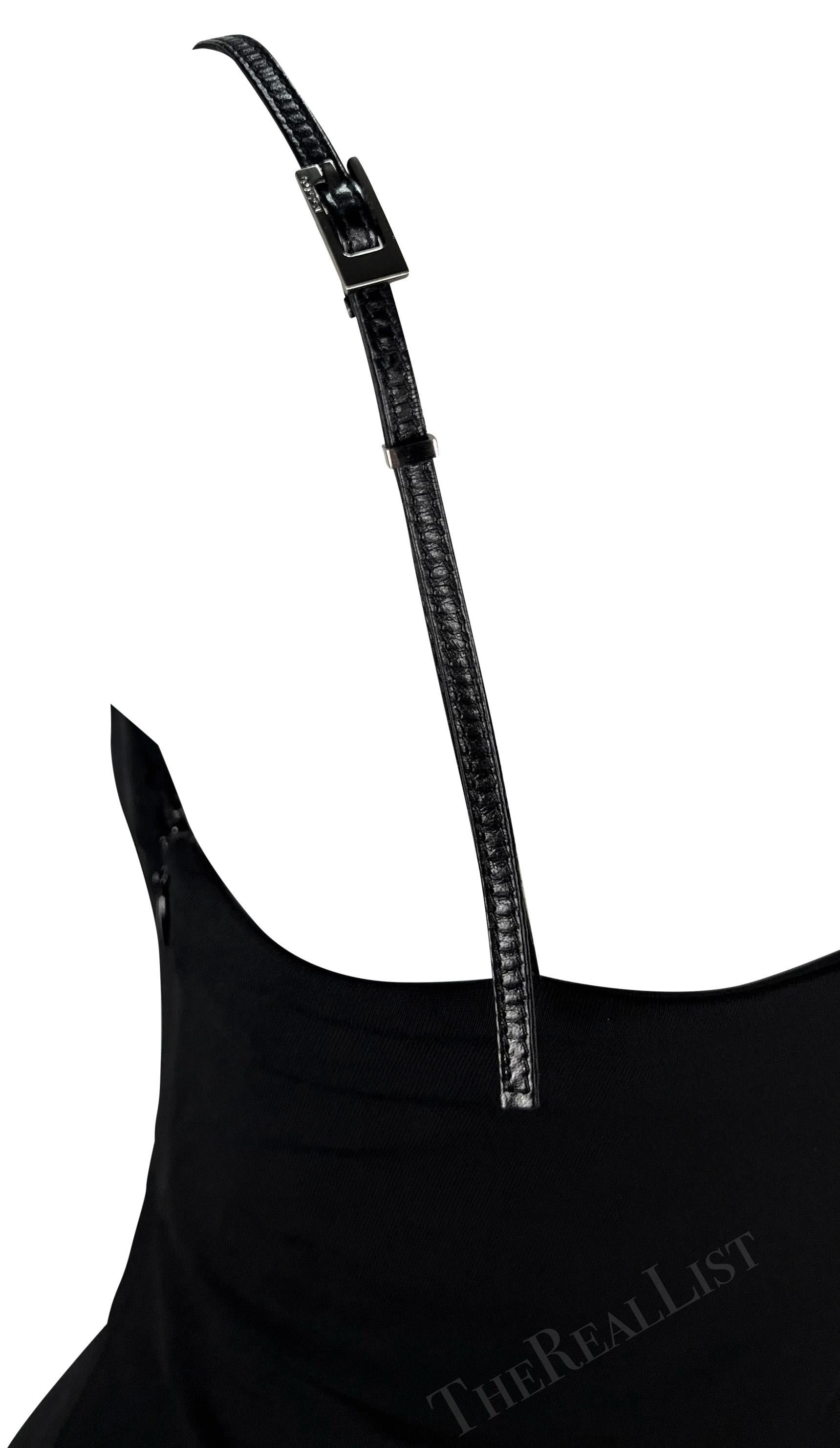 Introducing a stunning leather spaghetti strap Gucci dress, designed by Tom Ford. This dress from the Spring/Summer 1998 collection showcases the season's famous silver square 'G' buckles adorning both straps. Designed to accentuate the body's