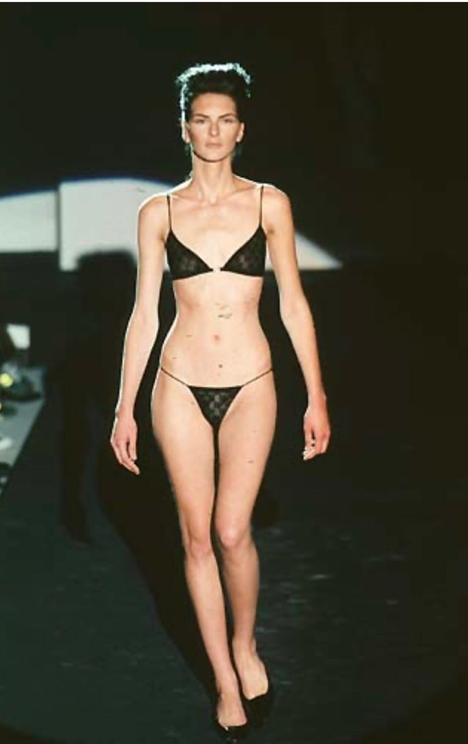 Presenting a fabulous black sheer Gucci 'GG' logo bra, designed by Tom Ford. From the Spring/Summer 1998 collection, this stunning bralette debuted on the season's runway and has since been seen on Kim Kardashian. This sheer bra is made complete