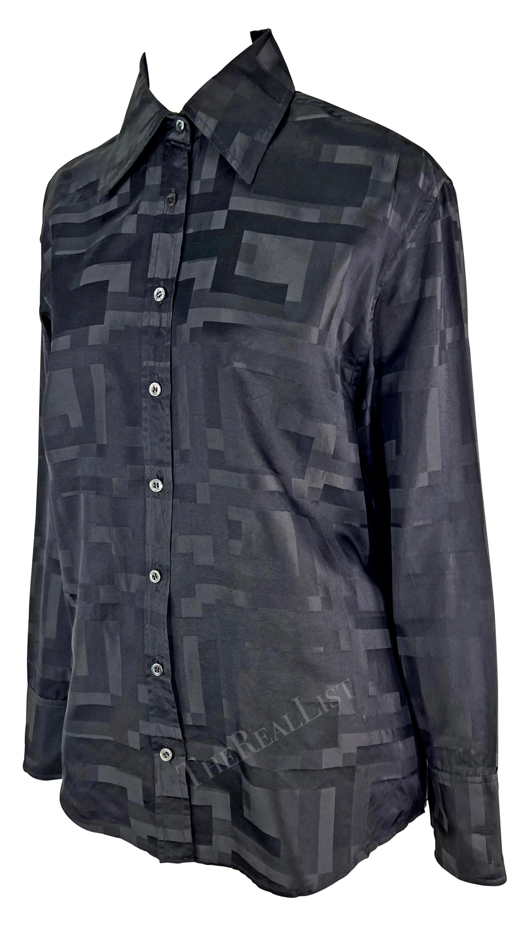 Presenting a black button-up Gucci shirt, designed by Tom Ford. From Gucci's Spring/Summer 1998 collection, this silk blend shirt is covered in an abstract square 'G' pattern and features a collar and front button closure. 

Approximate
