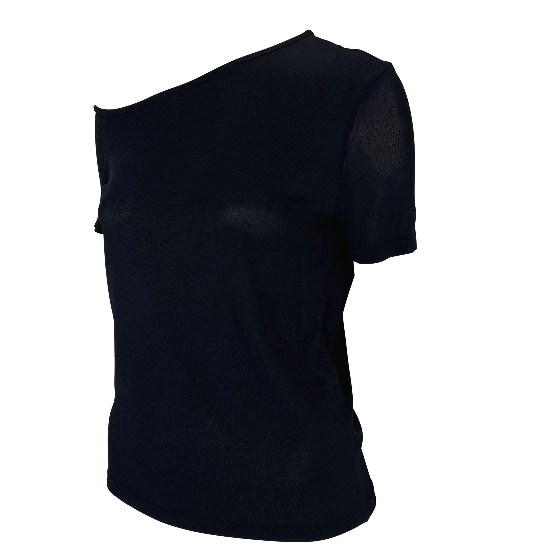 TheRealList presents: a fabulous knit navy asymmetric Gucci t-shirt, designed by Tom Ford. From the Spring/Summer 1998 collection, this elevated t-shirt is constructed of a semi-sheer navy top that is made complete with an asymmetric scoop neckline