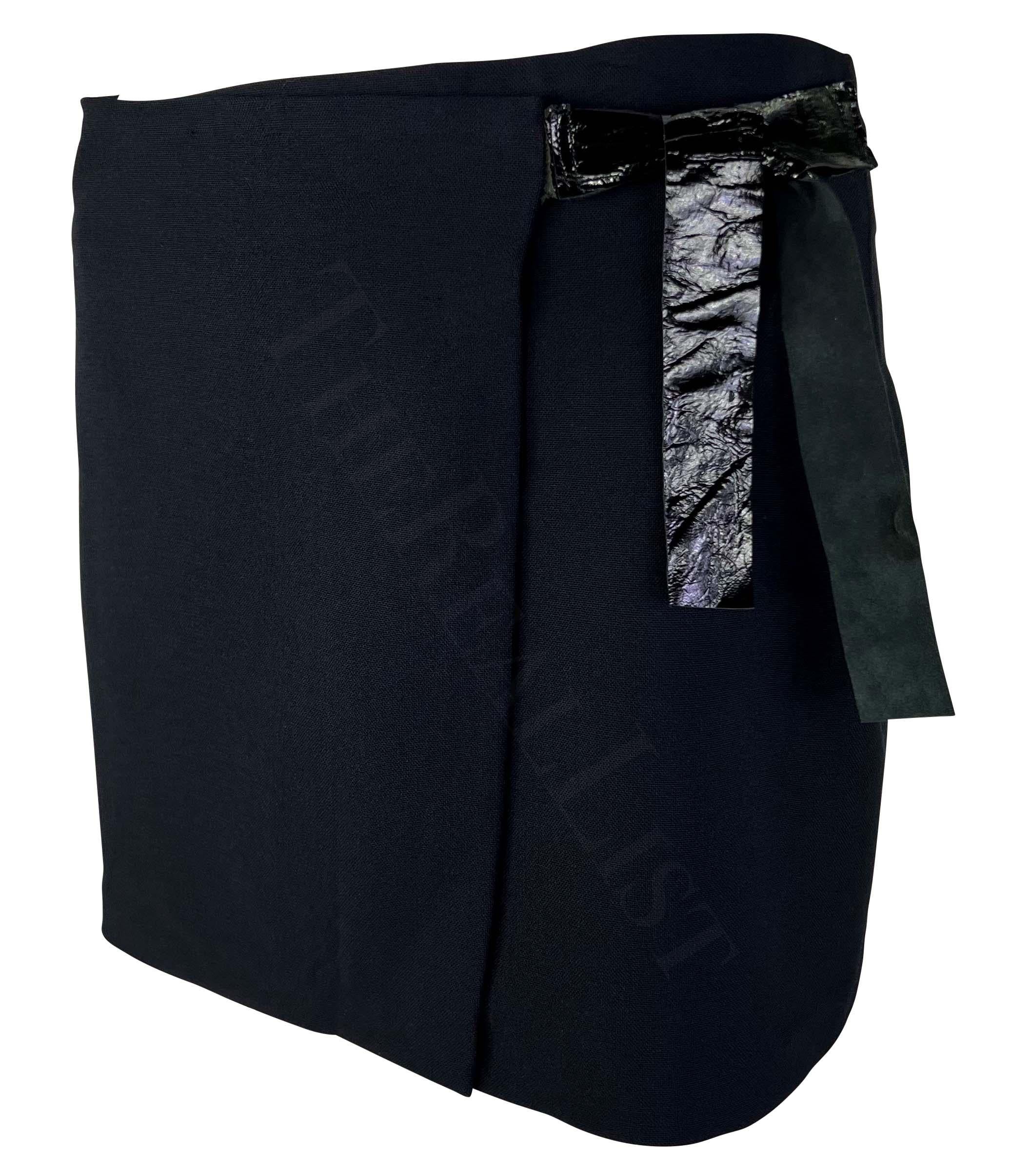 Presenting a fabulous navy Gucci wrap skirt, designed by Tom Ford. From the Spring/Summer 1998 collection, this sample skirt features a patent leather tie accent at one hip. A true prototype, the leather detail shows varying closure techniques. Add