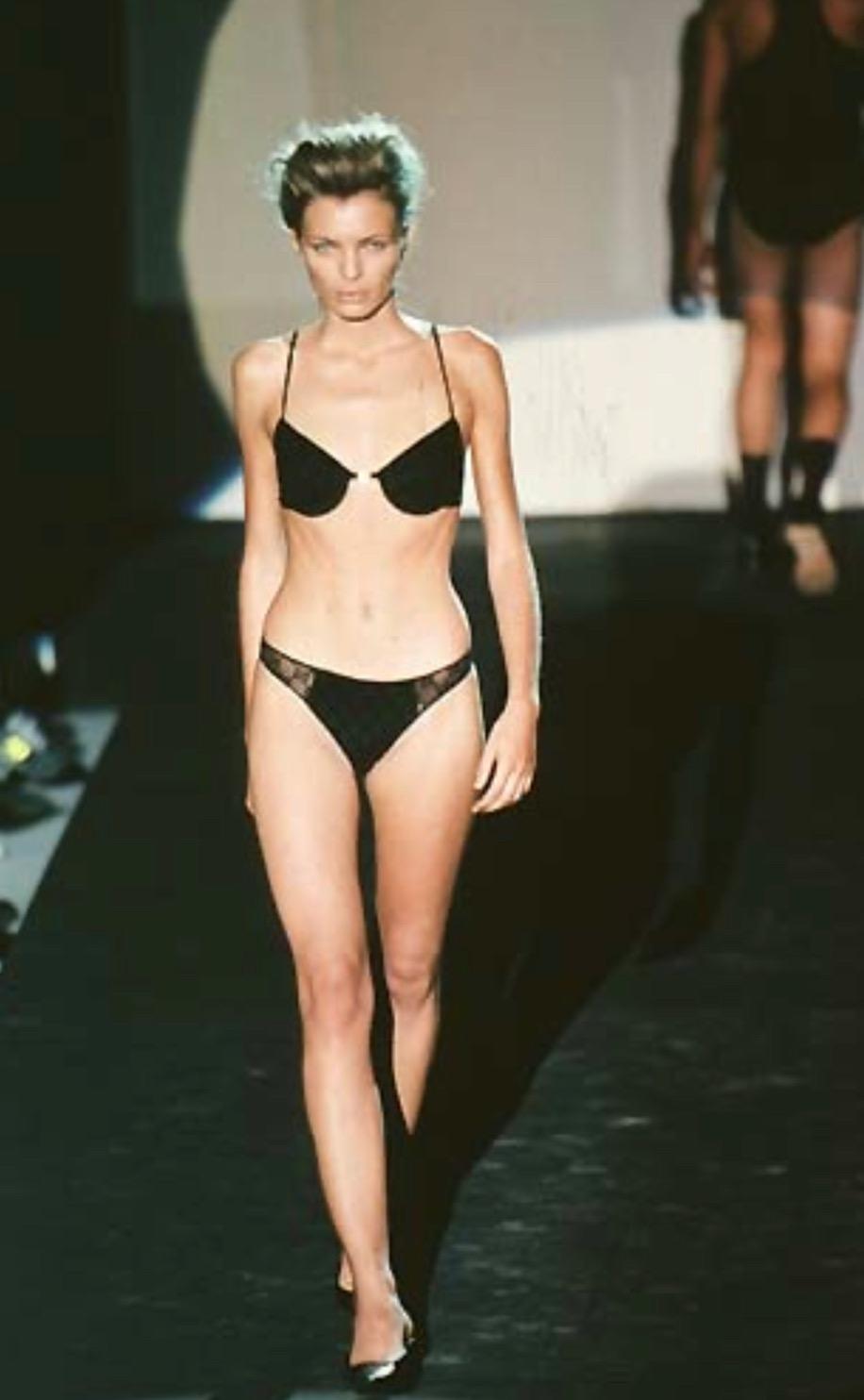 Presenting a fabulous black Gucci 'G' logo bra, designed by Tom Ford. From the Spring/Summer 1998 collection, this stunning bralette debuted on the season's runway and was as seen on early 2000s rapper Vita. This bra is made complete with a square