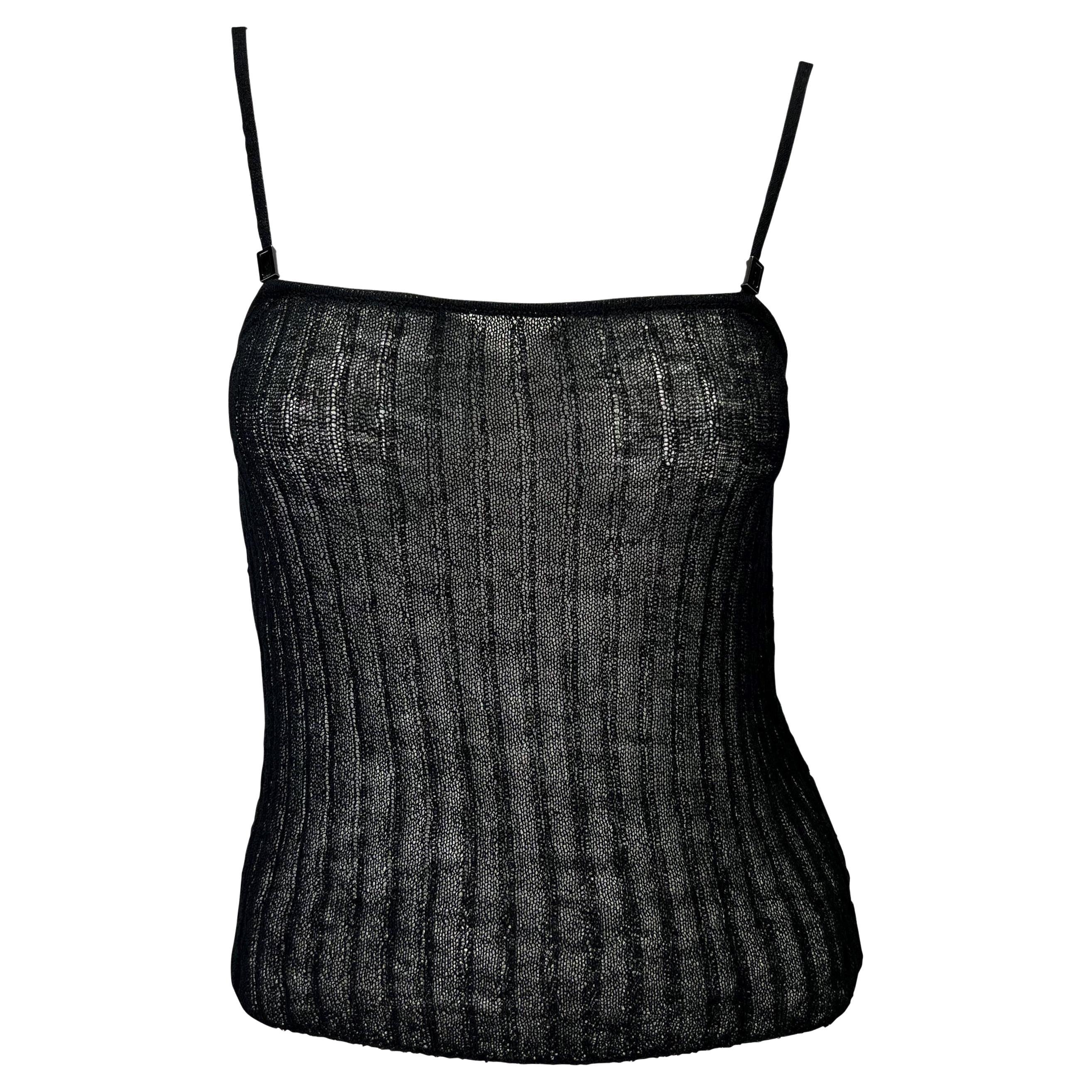 Presenting a black knit spaghetti strap Gucci tank top, designed by Tom Ford. From the Spring/Summer 1998 collection, this stunning tank top features a square neckline and moveable metal branded charms attached to the straps. Not your average tank