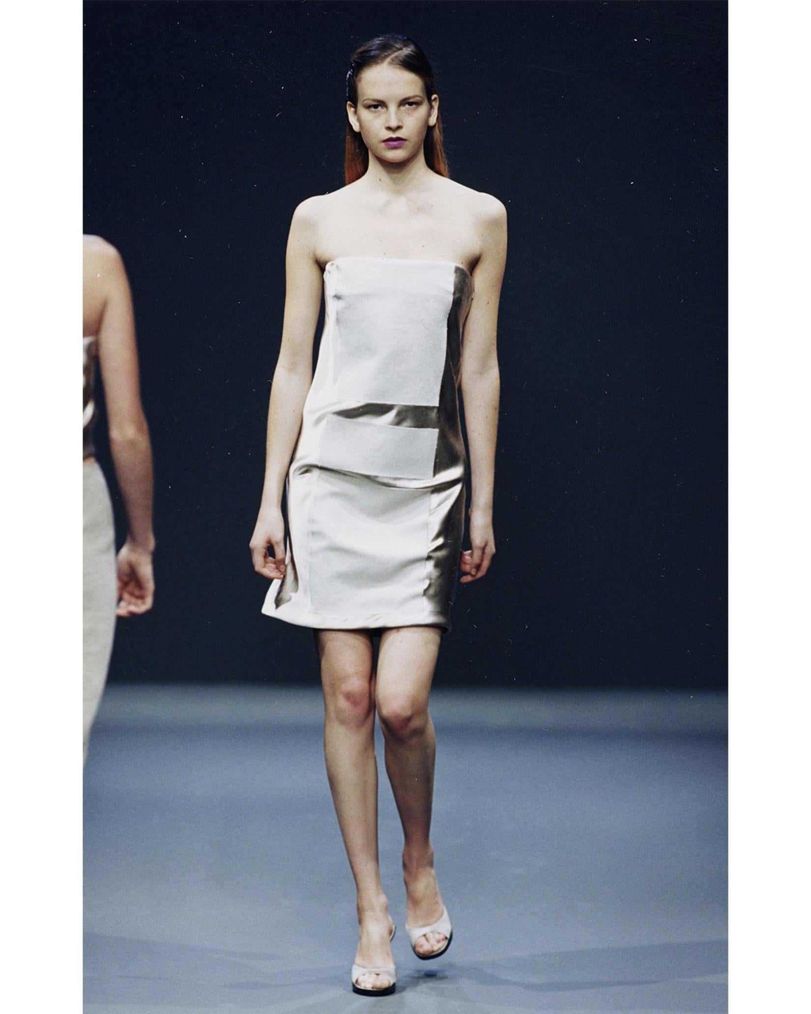S/S 1998 Prada by Miuccia Prada nude silk satin strapless geometric block mini dress. Concealed side zip closure. Contrasting silk satin with matte, linen blend geometric block paneling at front and back. Fully lined corset upper with 100% Rayon