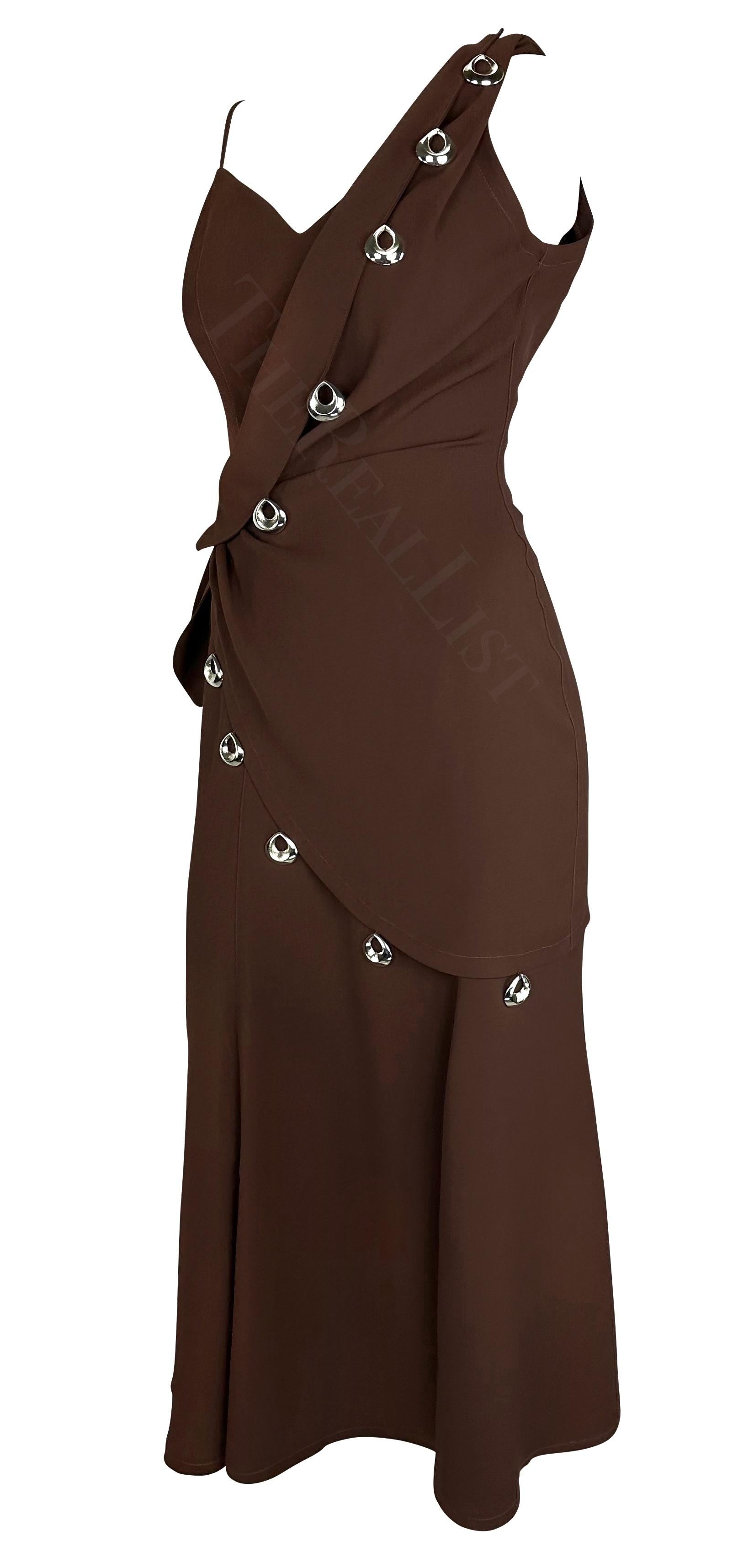 Presenting a brown Thierry Mugler wrap dress, designed by Manfred Mugler. From the Spring/Summer 1998, this midi dress features silver-tone hoop accents and a tie at the waist. Similar pendant detailing was featured on the season's Haute Couture