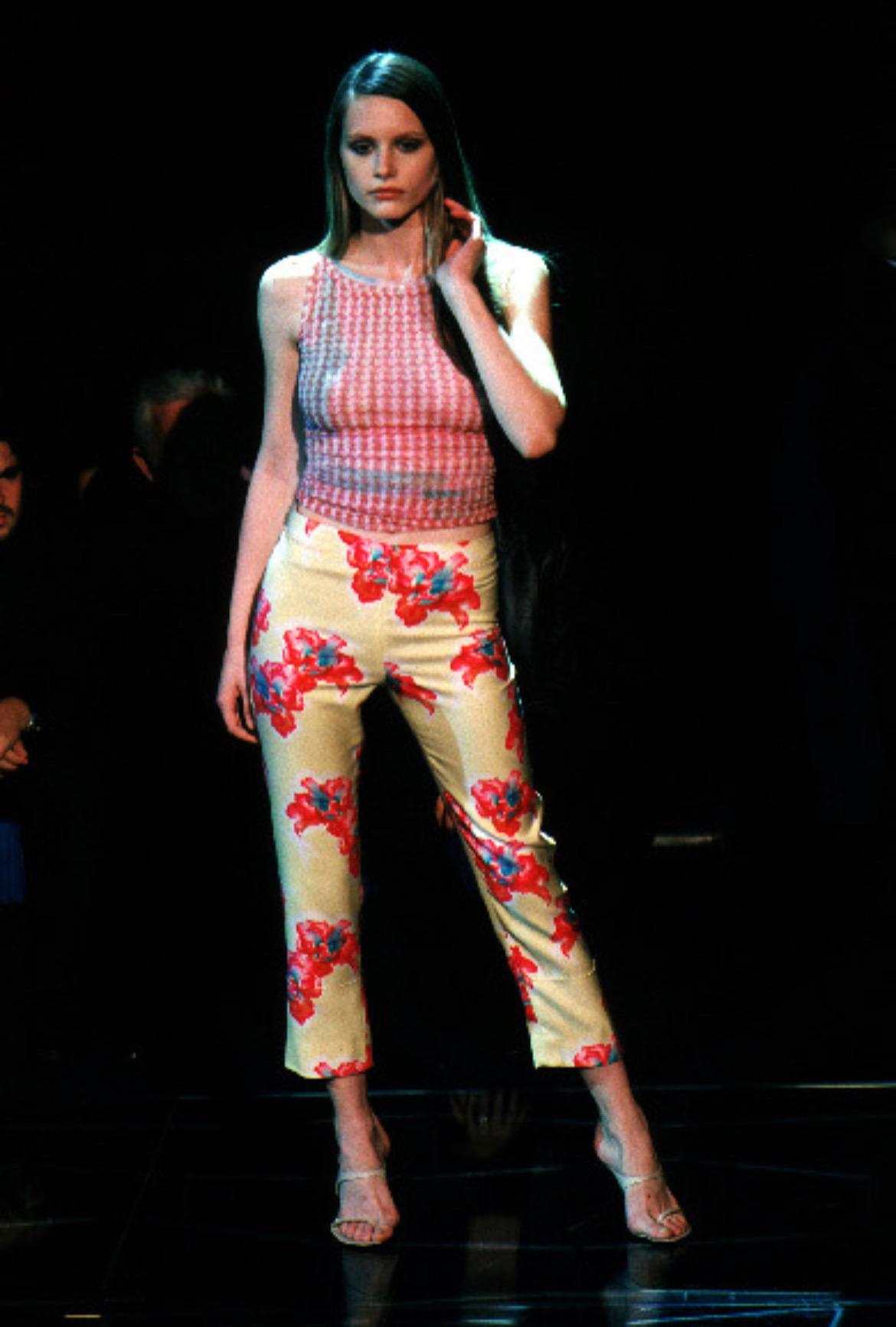 Presenting a fabulous pair of yellow floral Gianni Versace cropped pants, designed by Donatella Versace. From the Spring/Summer 1999 collection, these pants debuted on the season's runway and were also highlighted in the season's ad campaign,