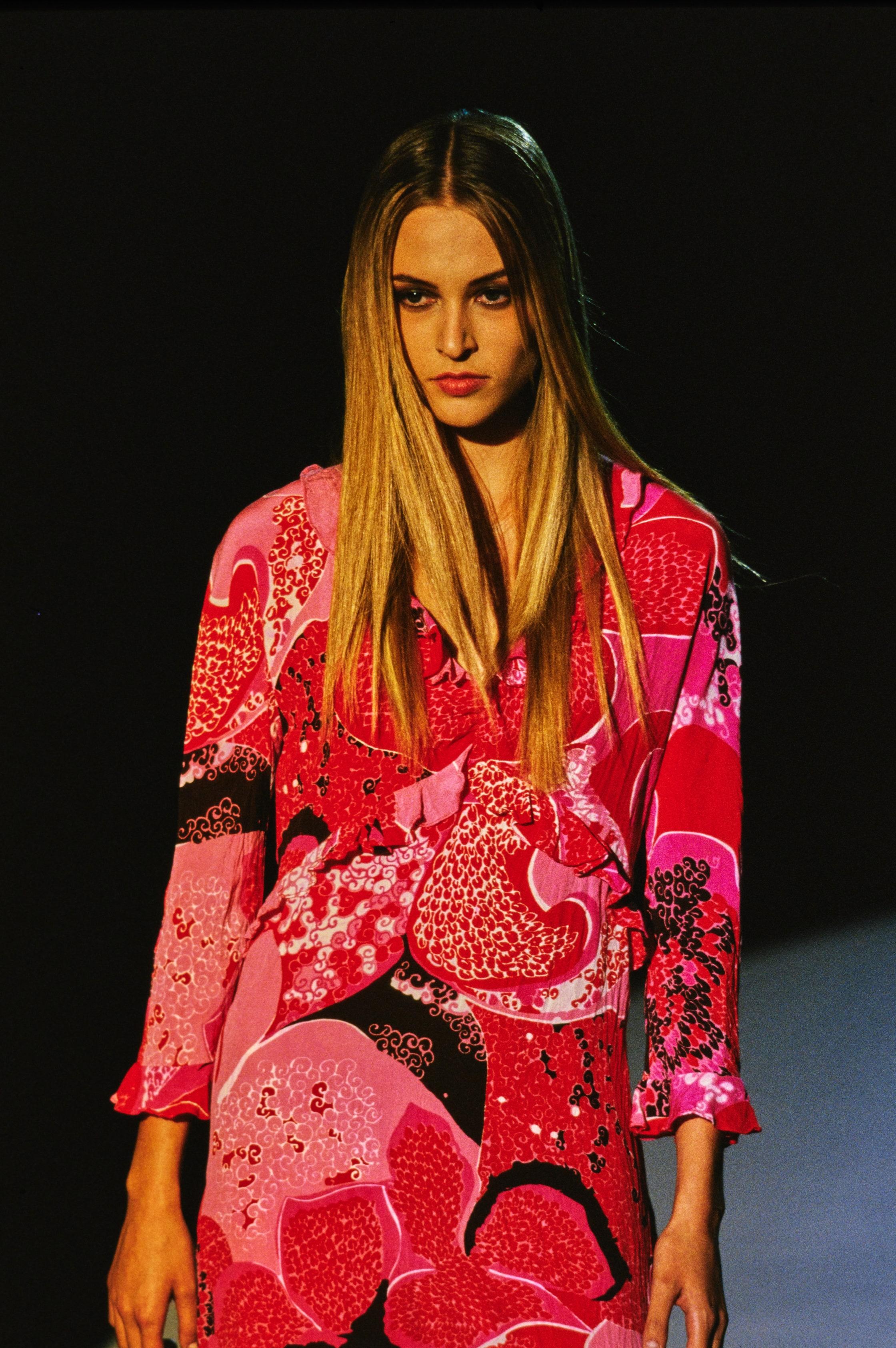 Presenting a vibrant 'acid flower' pink and red Gucci scarf, designed by Tom Ford. This beautiful scarf is from the Spring/Summer 1999 collection where this pattern debuted on two runway looks. Vogue interprets this collection as “a more colorful