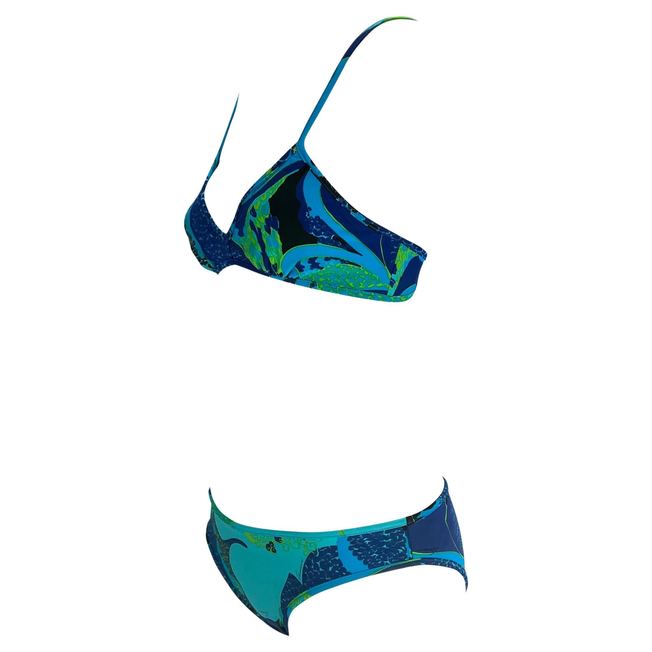 Presenting a blue 'acid flower' print Gucci bikini, designed by Tom Ford. From the Spring/Summer 1999 collection, this set is comprised of a triangle style top and hipster style shorts. This bikini set from Tom Ford's famous 'Las Vegas hippy'