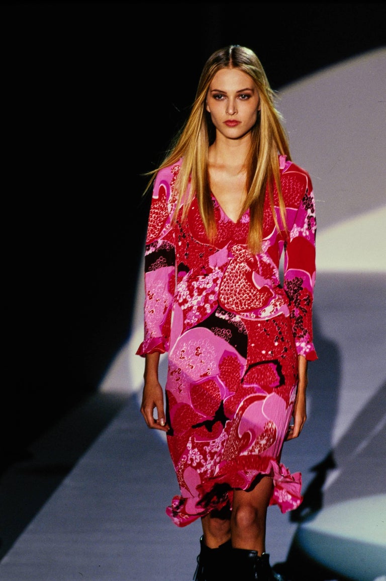 TheRealList presents: an 'Acid Flower' silk button-up top in pink from Tom Ford's 'Las Vegas Hippy' collection for Gucci. The S/S 1999 collection is remembered for its drastic departure from Tom Ford's signature sleek minimalism. After the success