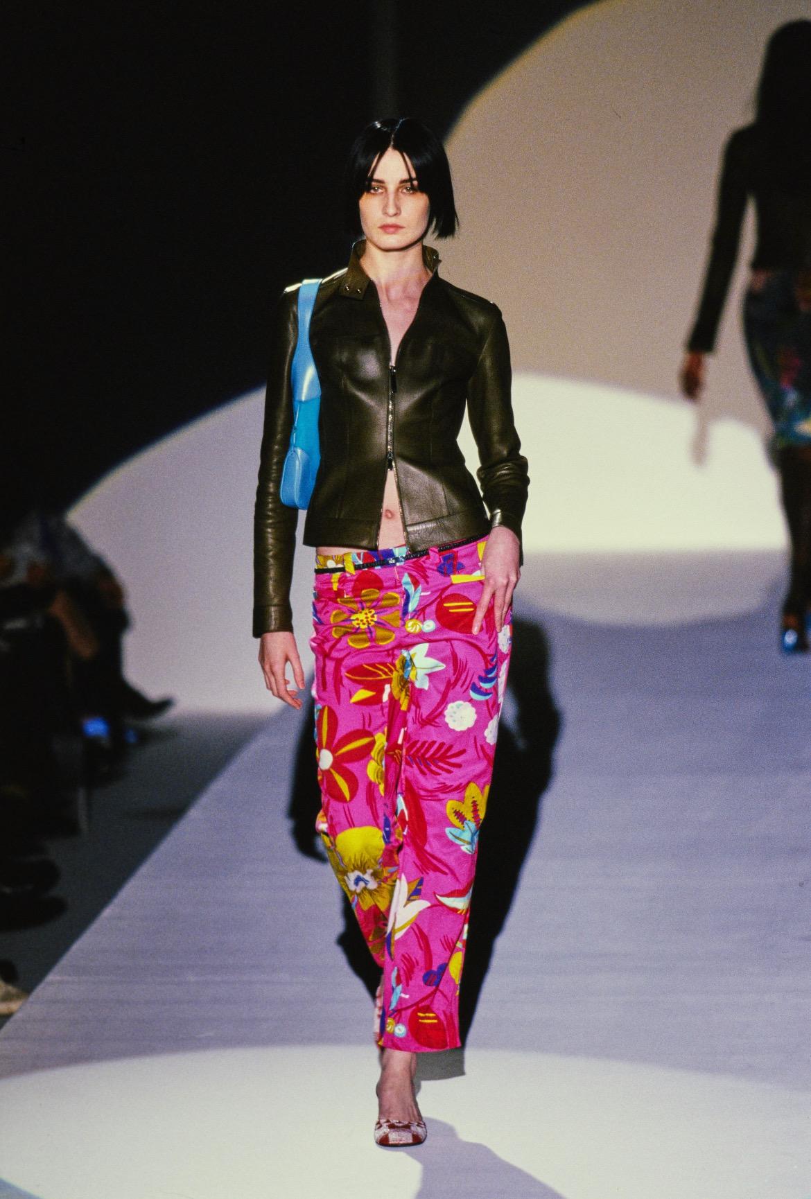 Presenting a pair of incredibly vibrant pink floral Gucci pants, designed by Tom Ford. From the Spring/Summer 1999 collection, these stunning pants debuted on the season's runway as part of look 5 modeled by Erin O'Connor. These bright pants boast