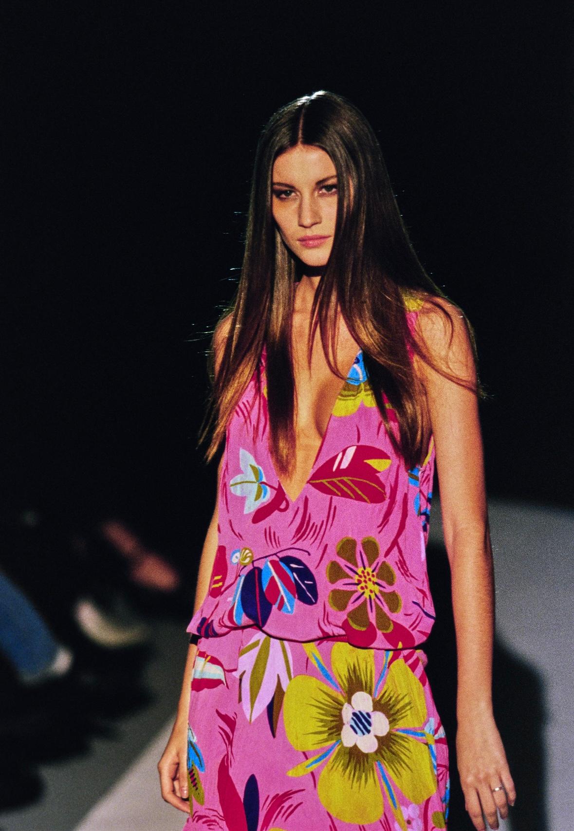 Presenting a psychedelic pink ruffled silk sleeveless flower power dress designed by Tom Ford for Gucci's Spring/Summer 1999 collection. Known as the 