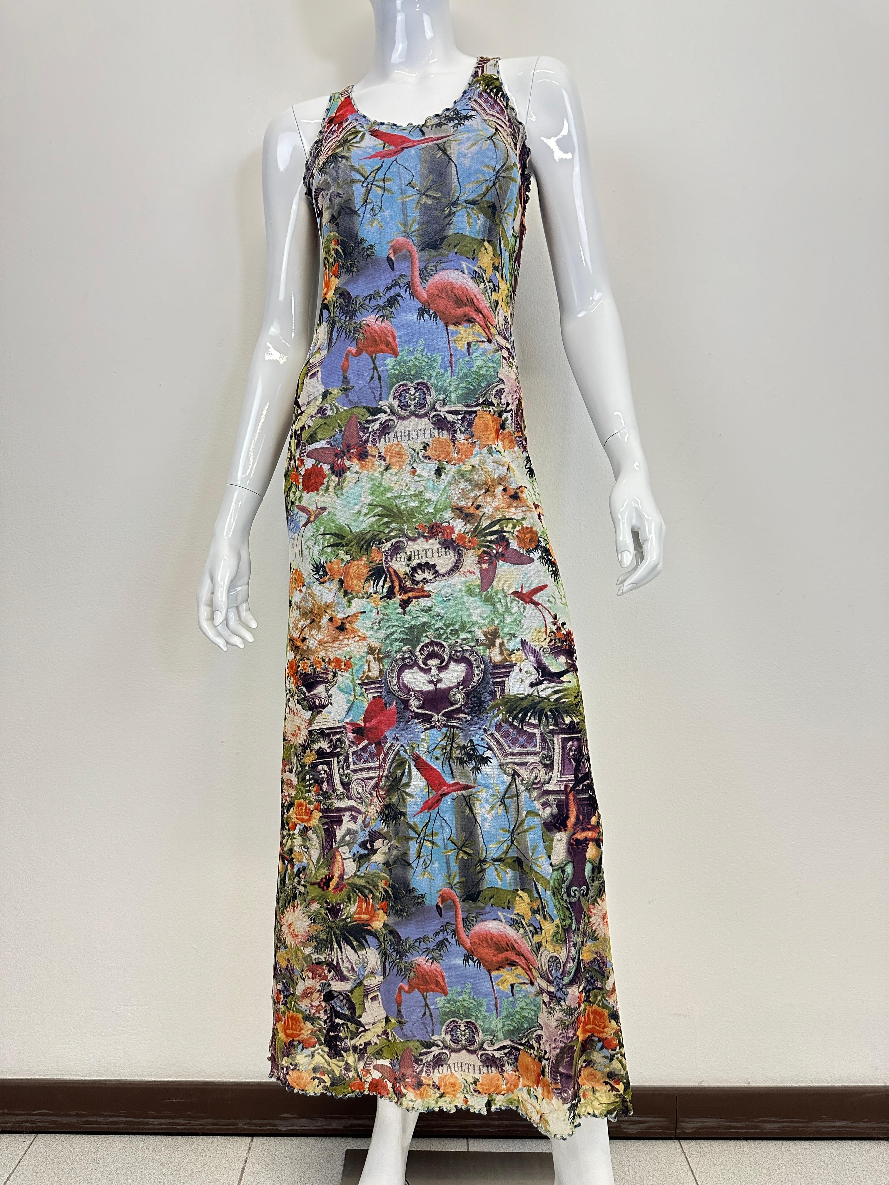 Stunning Jean Paul Gaultier flamingo maxi dress bodycon from S/S 1999. Made with the classic Gaultier mesh which is slightly transparent. Tropical imagery with flowers butterflies, birds and sculptures. Comes with matched mesh cardigan. 
Top seen on