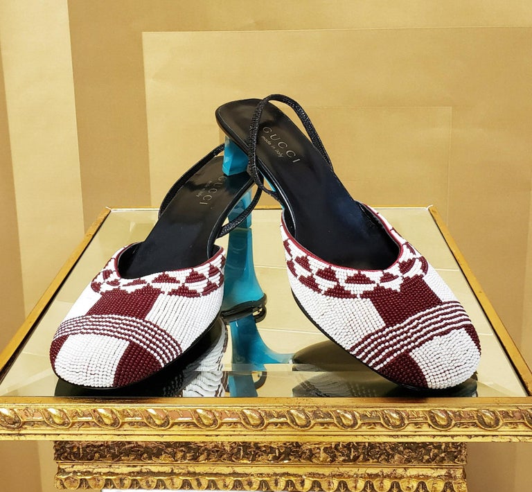 S/S 1999

GUCCI
ICONIC BEADED SHOES

Color: Red/White
Leather lining
Leather sole
Heel measures approximately 2''
Italy
 
Size is 8 B
Brand new, in excellent condition.

