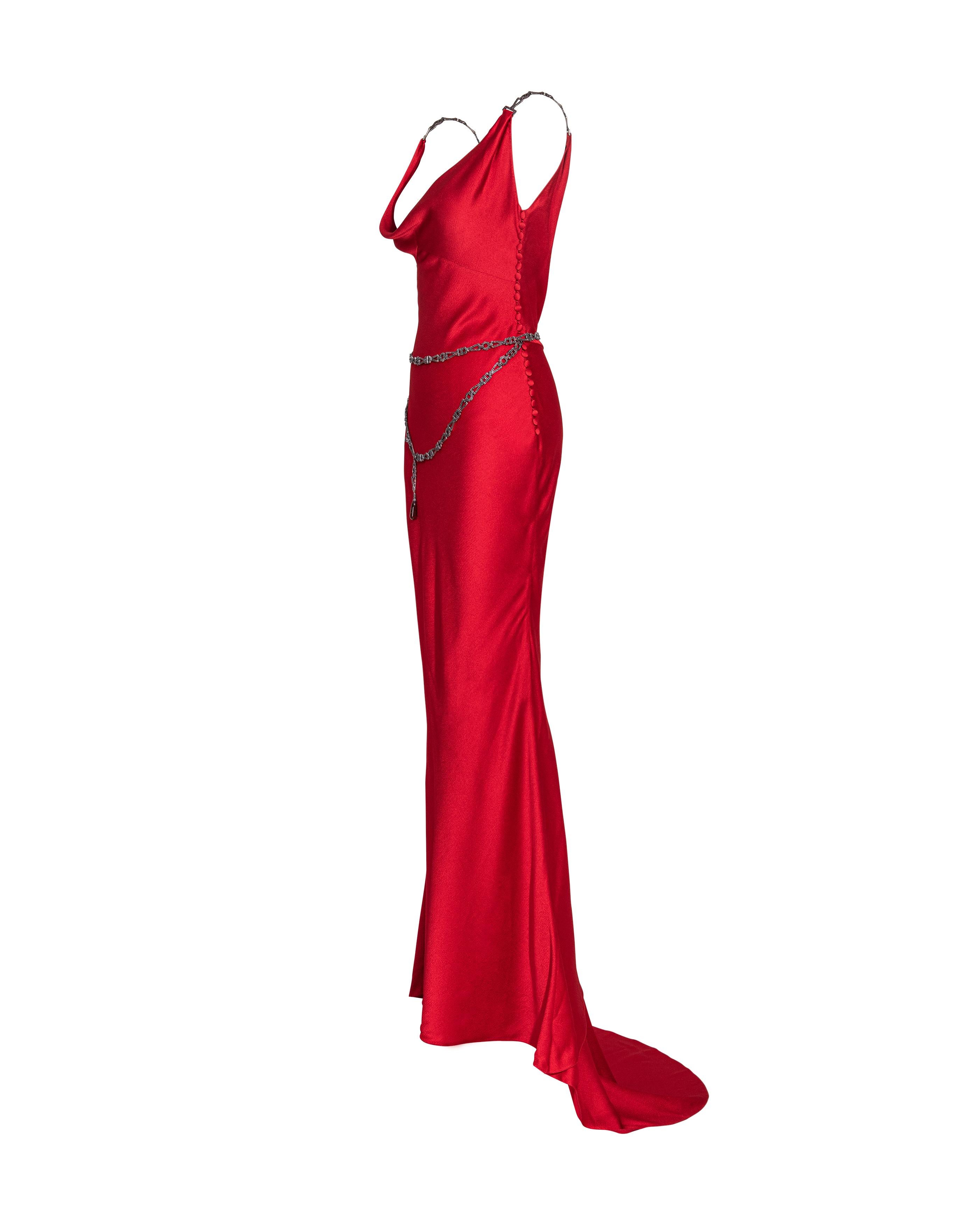 S/S 2000 Christian Dior by John Galliano red bias cut sleeveless gown with jeweled belt. Cowl neck bias cut slip gown. Gunmetal metallic geometric straps and waist belt with red rhinestone encrusted details throughout and oxblood colored gemstone