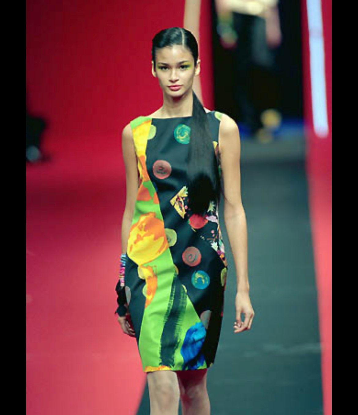 TheRealList presents: a colorful multi-print Christian Lacroix dress. From the Spring/Summer 2000 collection, this dress debuted on the season's runway as part of look 11. Featuring a bateau neckline, this fabulous sleeveless dress is constructed of