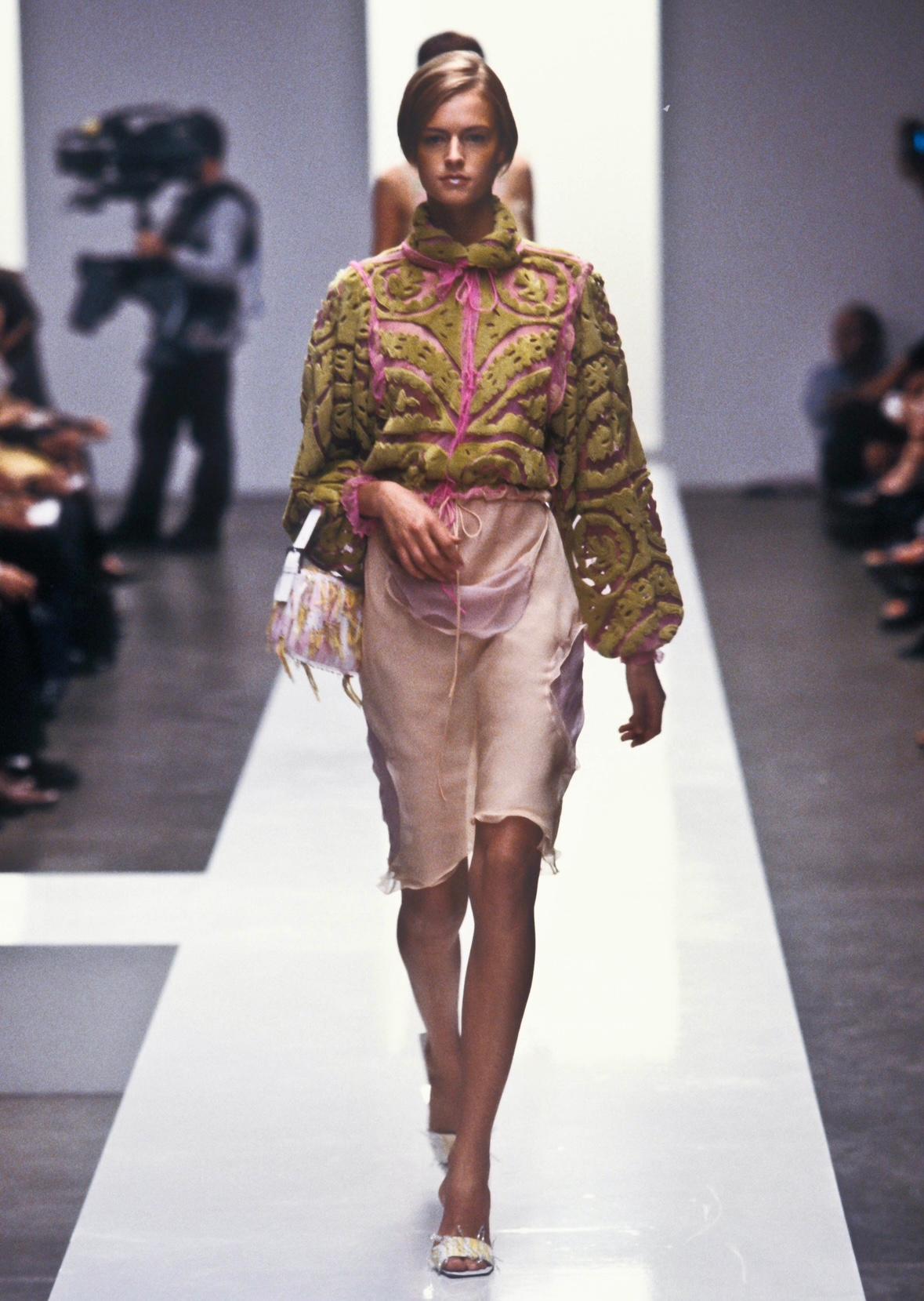 Presenting a neon pink mesh and acid green rabbit fur blouse designed by Karl Lagerfeld for Fendi. This piece debuted on the runway as part of Look 32 for the Spring/Summer 2000 collection. It was worn by Maggie Rizer and captured by Patrick