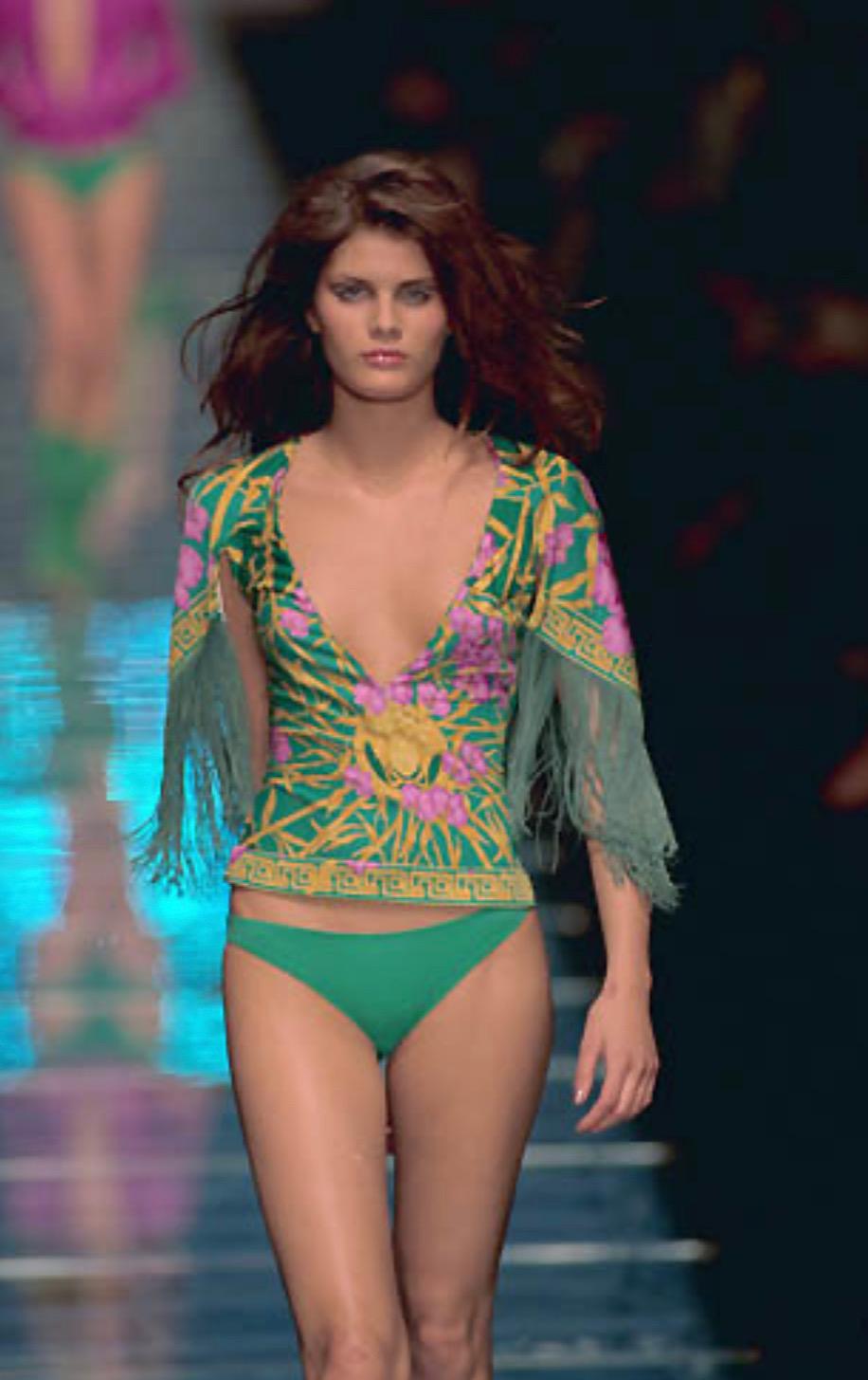 Presenting a fabulous jungle and orchid print Gianni Versace Couture shirt, designed by Donatella Versace. From the Spring/Summer 2000 collection, this top debuted as part of look 68 modeled by Isabeli Fontana. From the same collection as JLo's