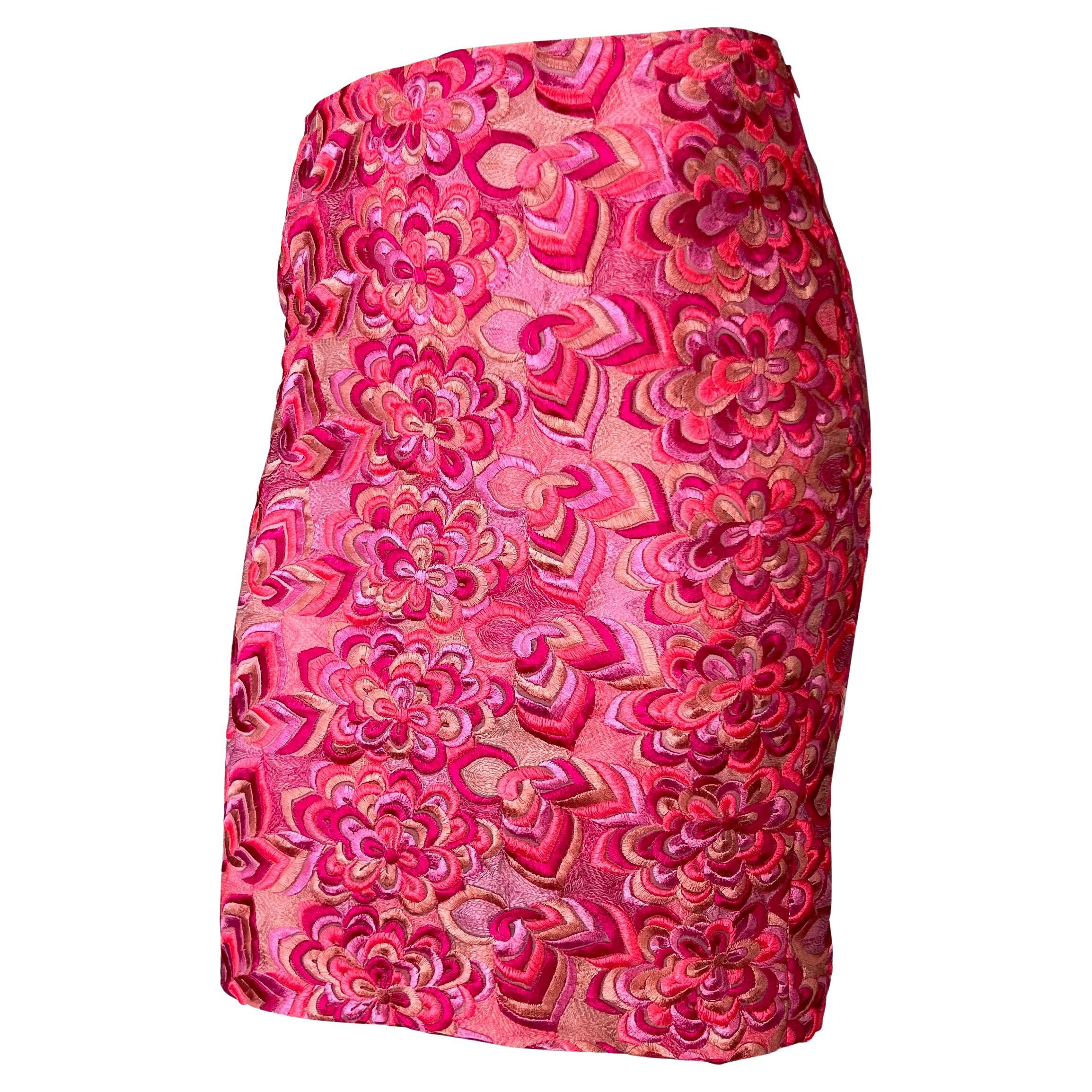 Presenting a hot pink skirt completely covered in intricate floral embroidery designed by Donatella for her landmark Spring/Summer 2000 collection for the Gianni Versace label. A rare find, this Y2K beauty is masterfully tapered to hug the body. 


