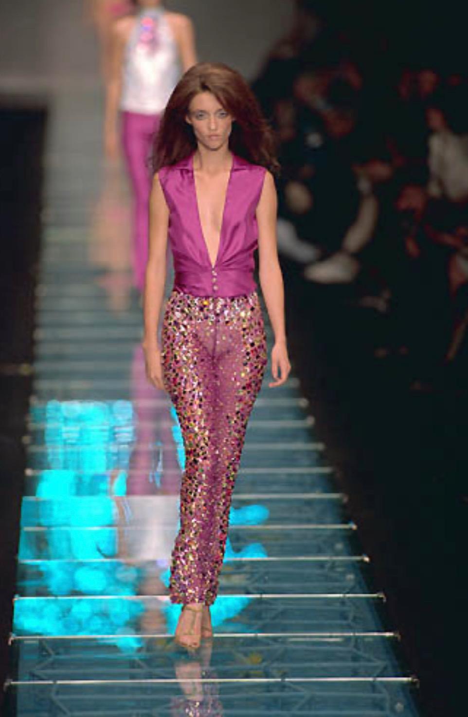 Presenting an incredible bright purple Gianni Versace Couture shirt, designed by Donatella Versace. From the Spring/Summer 2000 collection, this top debuted on the season's runway as part of look 53 modeled by Audrey Marnay. This sleeveless top