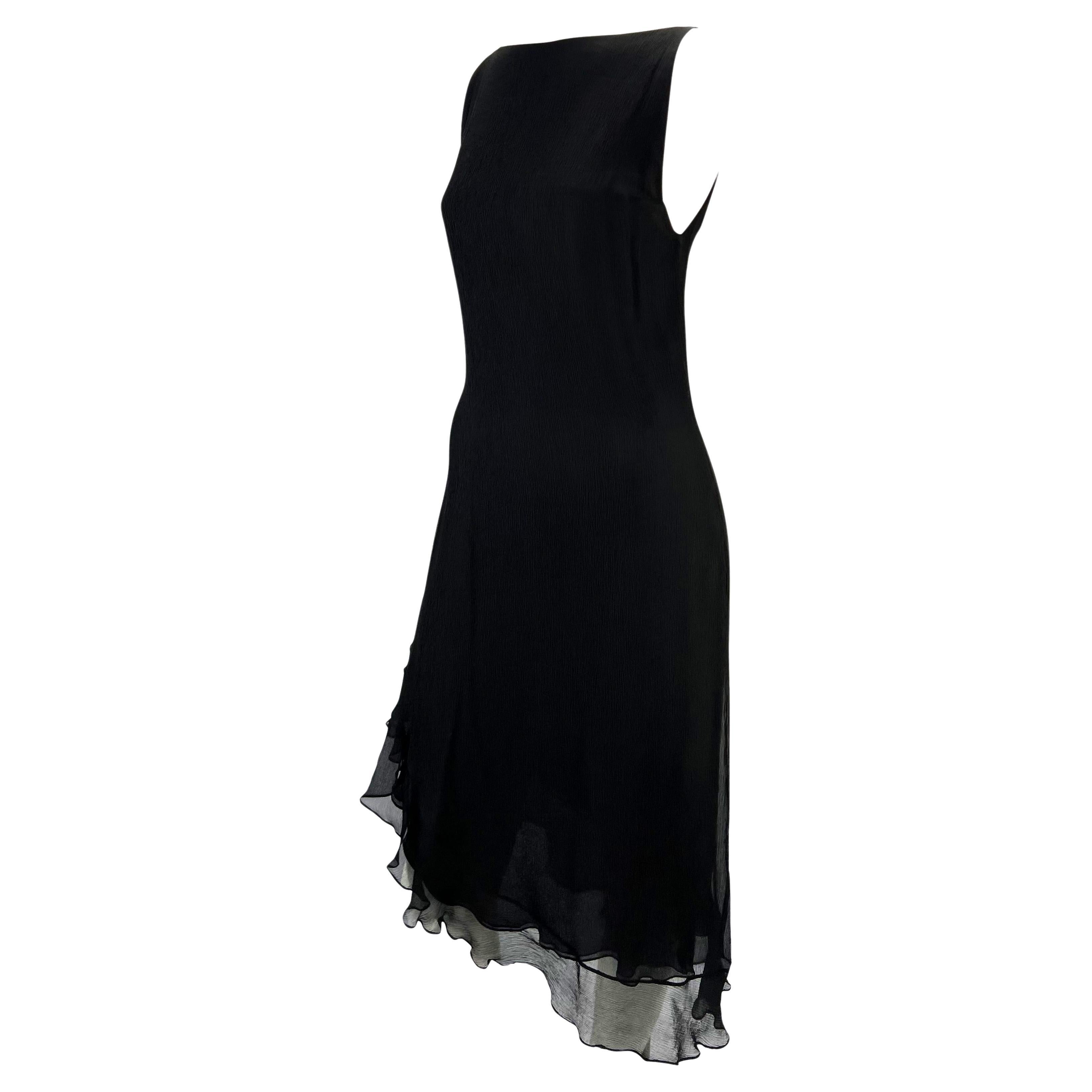 TheRealList presents: a beautiful black crepe silk Gucci dress, designed by Tom Ford. From the Spring/Summer 2000 collection, this effortlessly stunning dress features a high neckline and asymmetric ruffle hem. One armhole is intentionally left