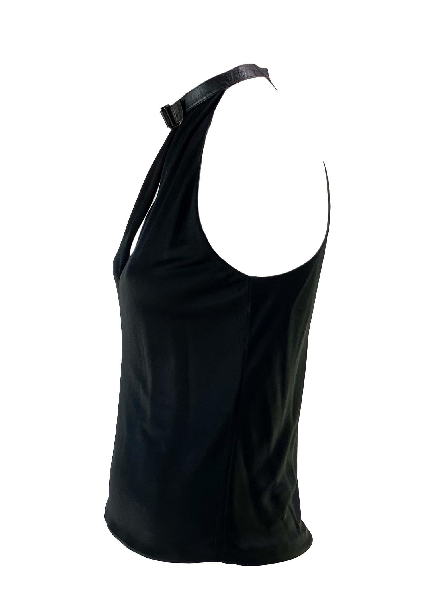 TheRealList presents: an asymmetric Gucci tank top, designed by Tom Ford. This unique top features a leather ribbon collar with an adjustable buckle and a deep neckline. Not your average Gucci top, this shirt was designed by Ford for the