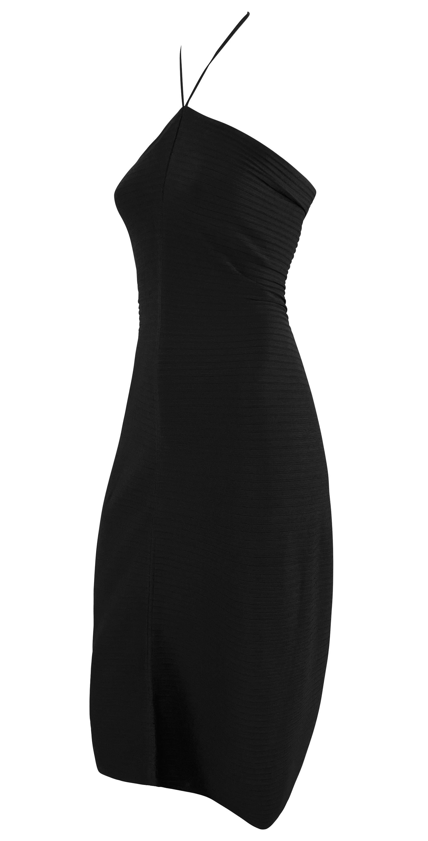 Presenting a black stretch Gucci tube dress designed by Tom Ford from the 2000 Spring/Summer collection. This form-fitting ribbed dress features a halterneck with a 'Gucci'-stamped metal closure at the neck. This ultra-chic piece is a Tom Ford Gucci