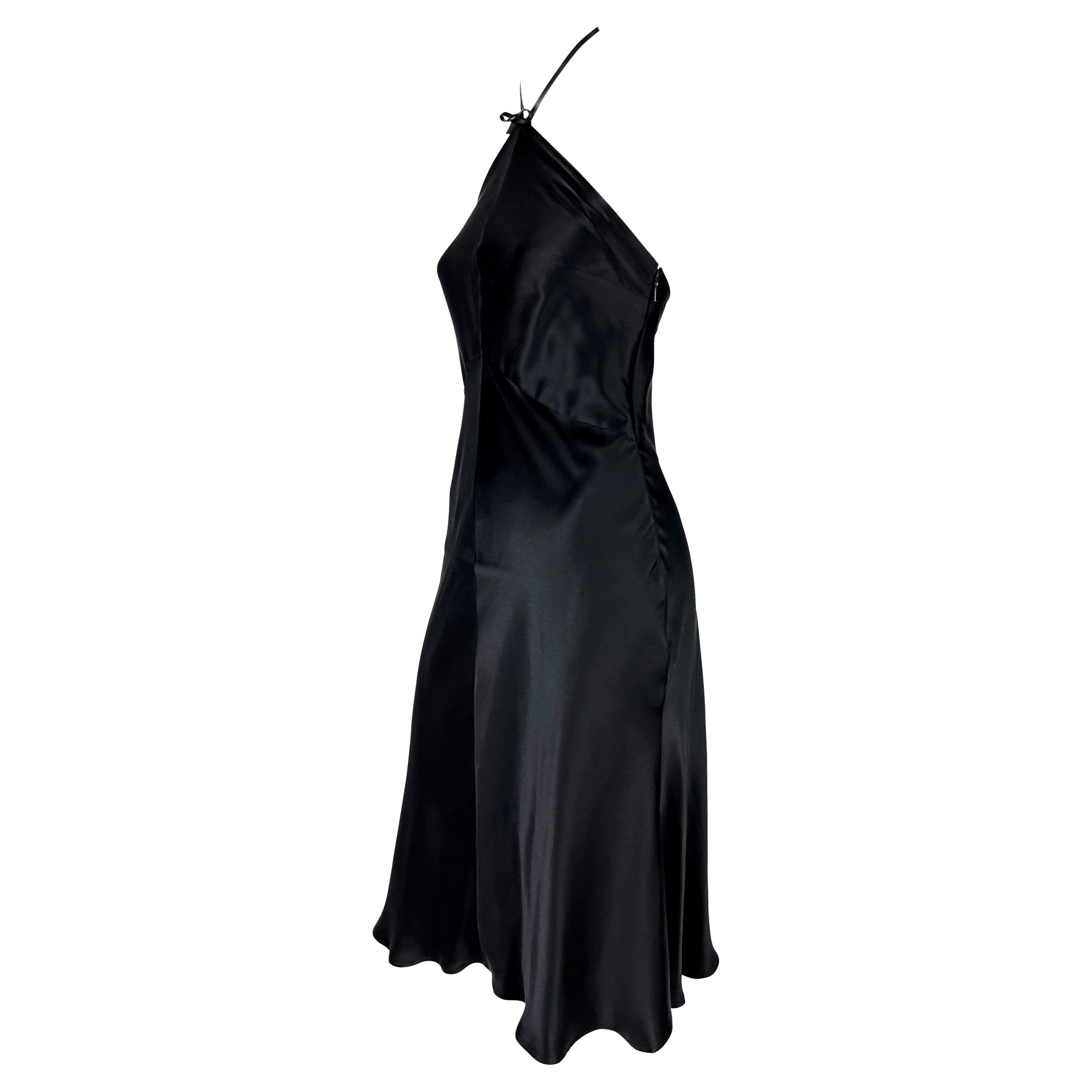 TheRealList presents: a stunning black silk satin Gucci halterneck dress, designed by Tom Ford. From the Spring/Summer 2001 collection, this fabulous dress is constructed entirely of black silk satin with a flare-cut skirt and is made complete with