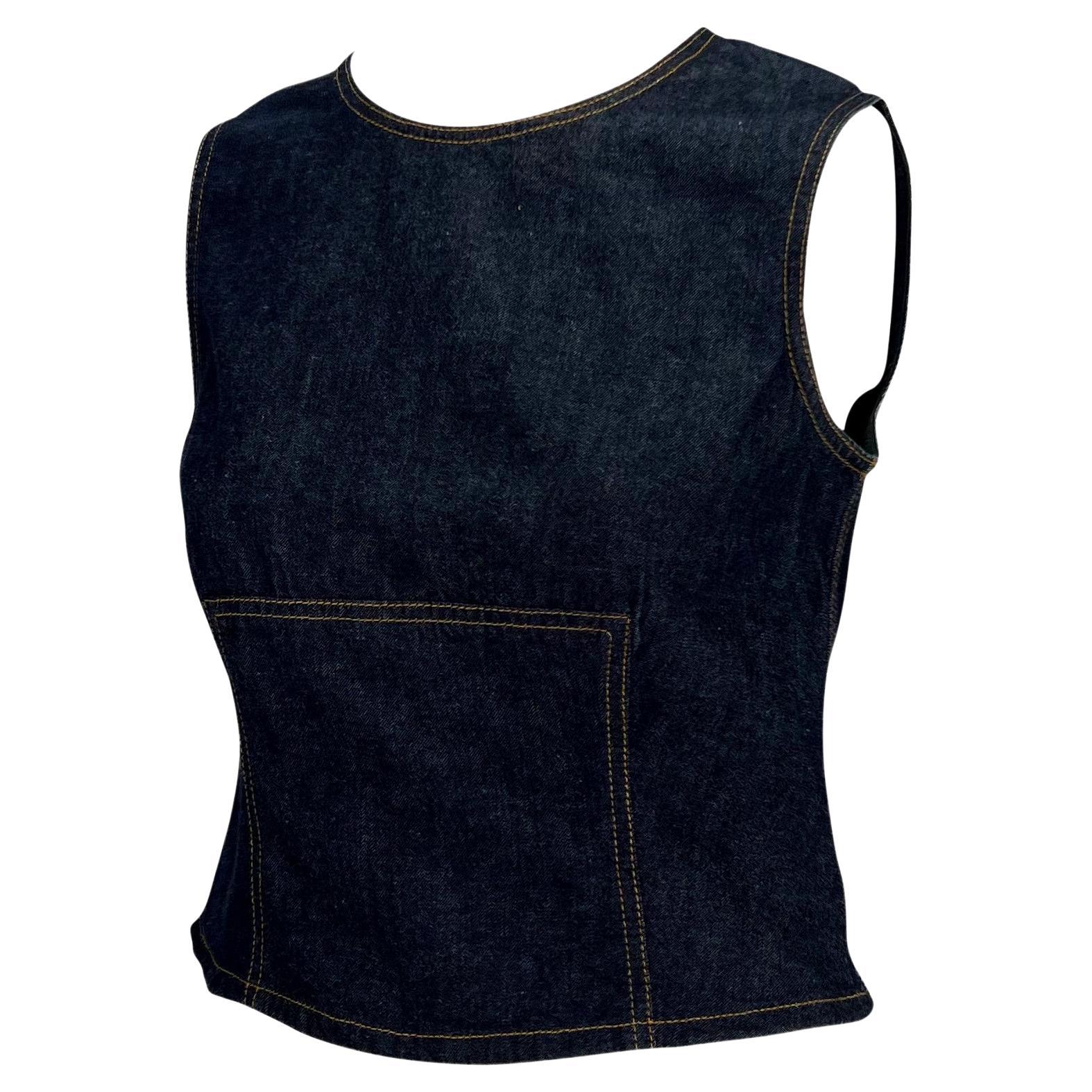 Presenting a sleeveless denim Gucci top, designed by Tom Ford. From the Spring/Summer 2000 collection, this denim top is fashioned with beige stitching, accentuating the female form. A wonderful and chic Y2K piece, this versatile top is sure to