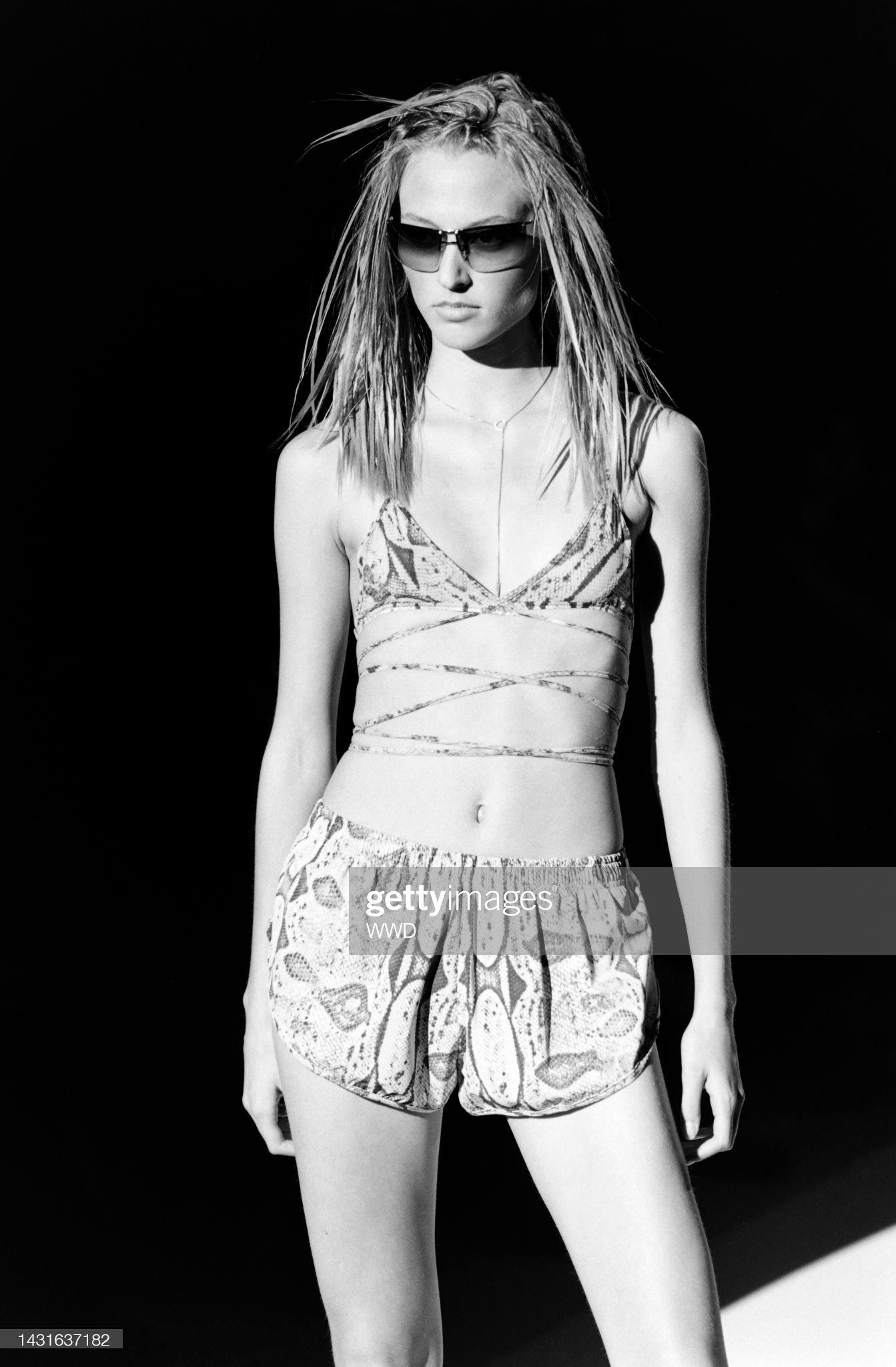 Presenting a pair of tan Gucci snakeskin print mini shorts, designed by Tom Ford. From the Spring/Summer 2000 collection, these shorts debuted on the season's runway as part of look 32, modeled by Liisa Winkler. Covered in a snakeskin print, these
