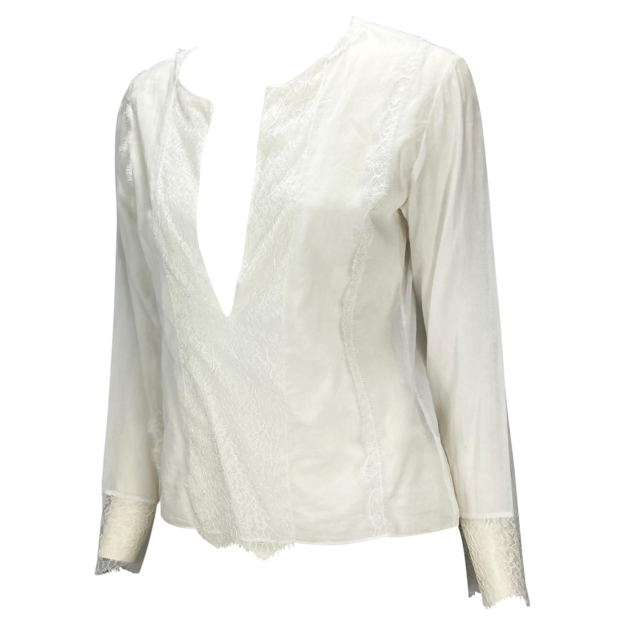 Presenting a gorgeous semi-sheer lace Gucci blouse, designed by Tom Ford. From the Spring/Summer 2000 collection, this free-flowing blouse is constructed of light cotton and lace. The top features a plunging neckline with a lace panel down the