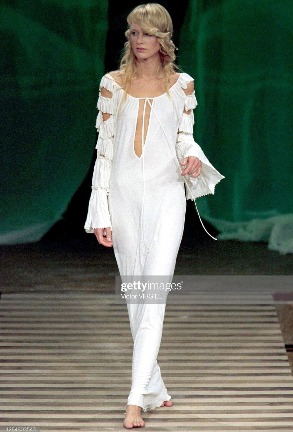 TheRealList presents: a fabulous dark green Jean Paul Gaultier bodycon gown. From the Spring/Summer 2000 collection, this incredible dress debuted on the season's runway in white. Constructed of silky viscose and perfectly falls on the body, the