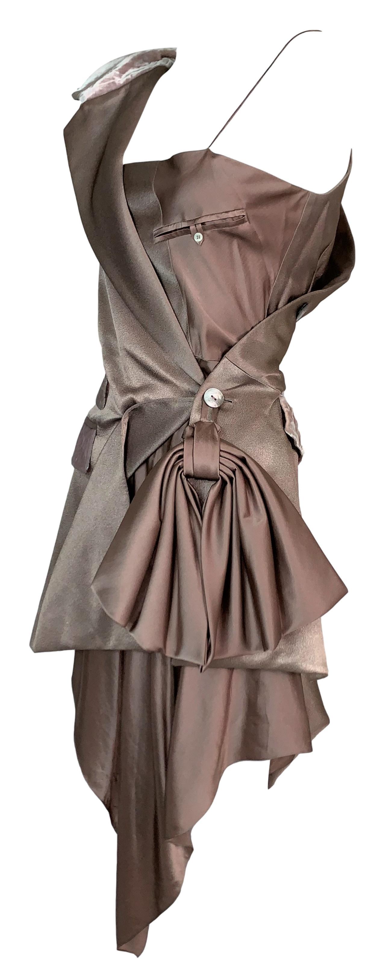 DESIGNER: S/S 2000 John Galliano

Please contact us for more images or information

CONDITION: Good- no holes- light discoloration on edge of pocket flap- wear to silk underskirt- these are something others will notice when worn, very minor- see
