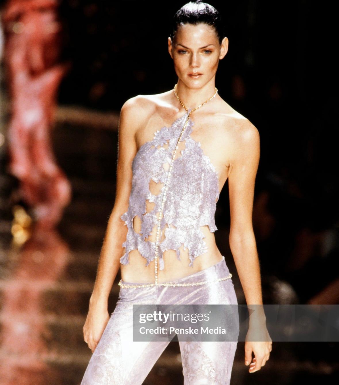 Presenting a gold-tone rhinestone accented Roberto Cavalli body chain. From the Spring/Summer 2000 collection, this costume body chain debuted on the season's runway with similar versions in several looks. This chic body chain shimmers and shines