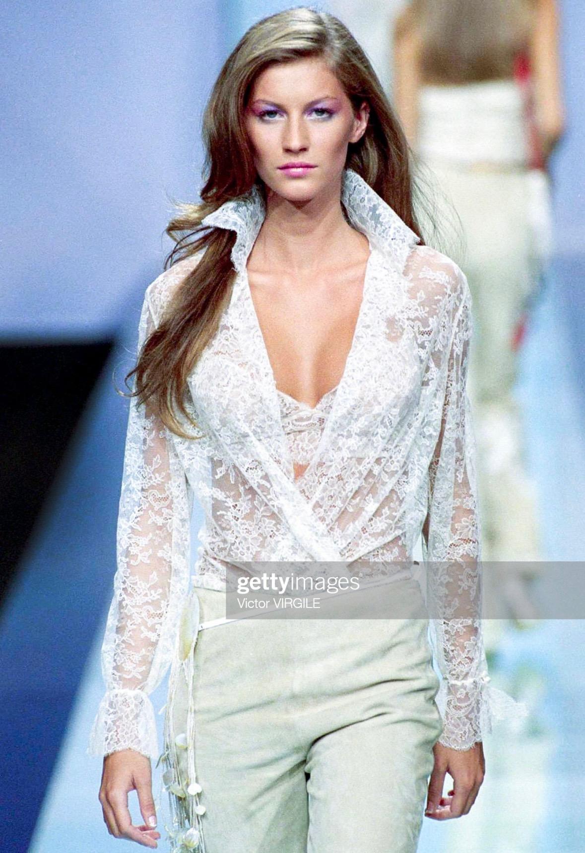 Presenting a fabulous tan Valentino lace bralette. From the Spring/Summer 2000 collection, a version of this tan bralette debuted on the season's runway on Gisele Bündchen and is constructed of sheer cream floral lace and features spaghetti