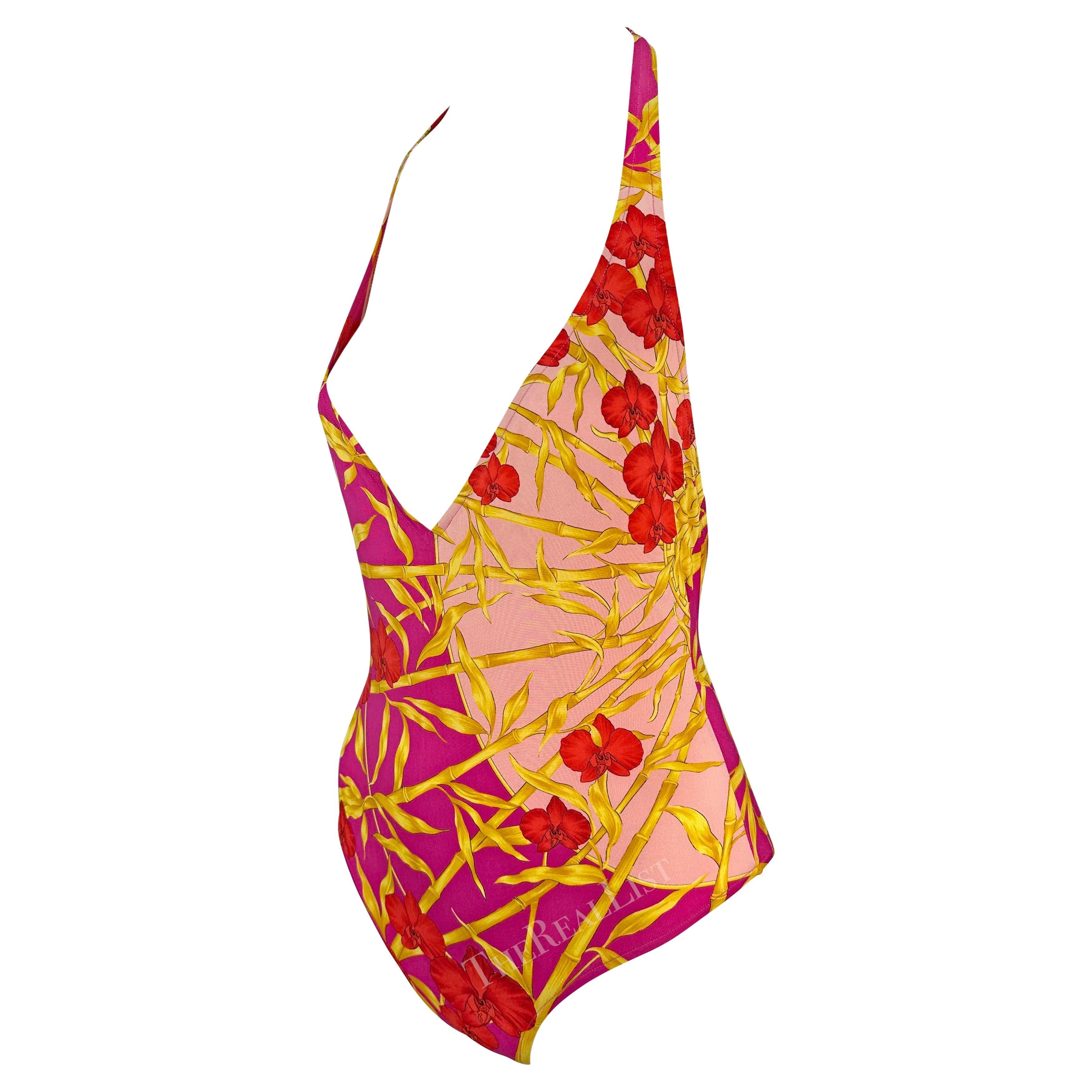 Presenting a pink jungle print Gianni Versace one-piece swimsuit, designed by Donatella Versace. From the Spring/Summer 2000 collection, the same collection as the infamous green JLo dress, this one-piece swimsuit/bodysuit is covered in a bright