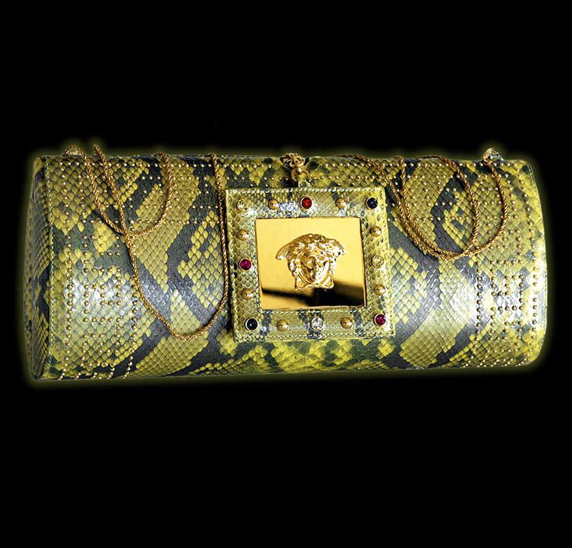 S/S 2000 
Vintage Gianni Versace Python Clutch with gold-tone hardware, stud and crystal embellishments.  
Yellow satin lining.

Removable Chain Shoulder Strap  (Drop: 24