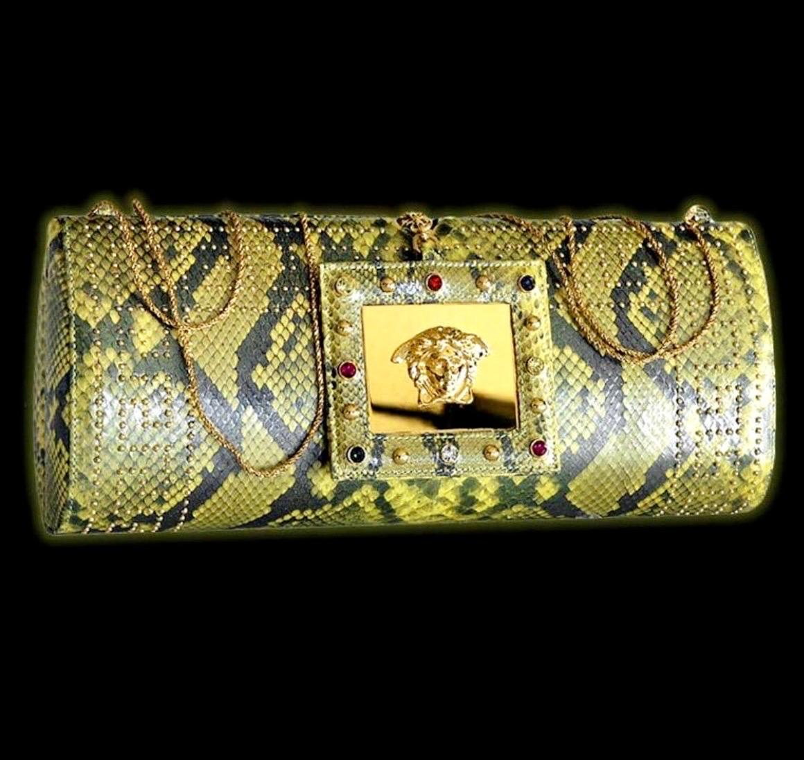 S/S 2000
Vintage Gianni Versace Python Clutch with gold-tone hardware, stud and crystal embellishments.
Yellow satin lining.
Removable Chain Shoulder Strap (Drop: 24