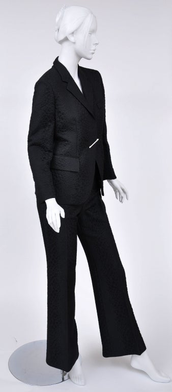 S/S 2000 Collection

Crocodile textured pant suit is finished with silver jeweled pin.

IT Size 42

Excellent condition