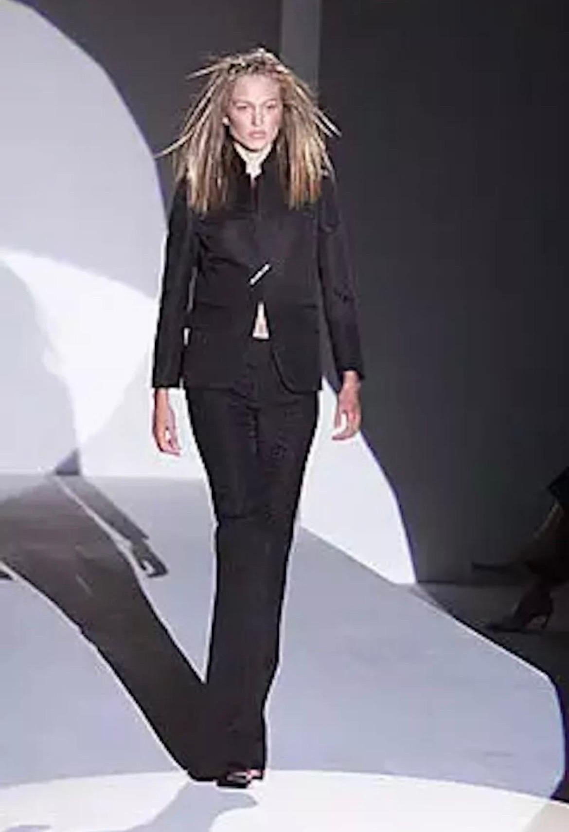 S/S 2000 
Tom Ford for Gucci
Crocodile textured pant suit is finished with silver jeweled pin.
Color: Dark Brown
Unlined
IT Size 42, US - 6
Pants: waist (measured flat) 14