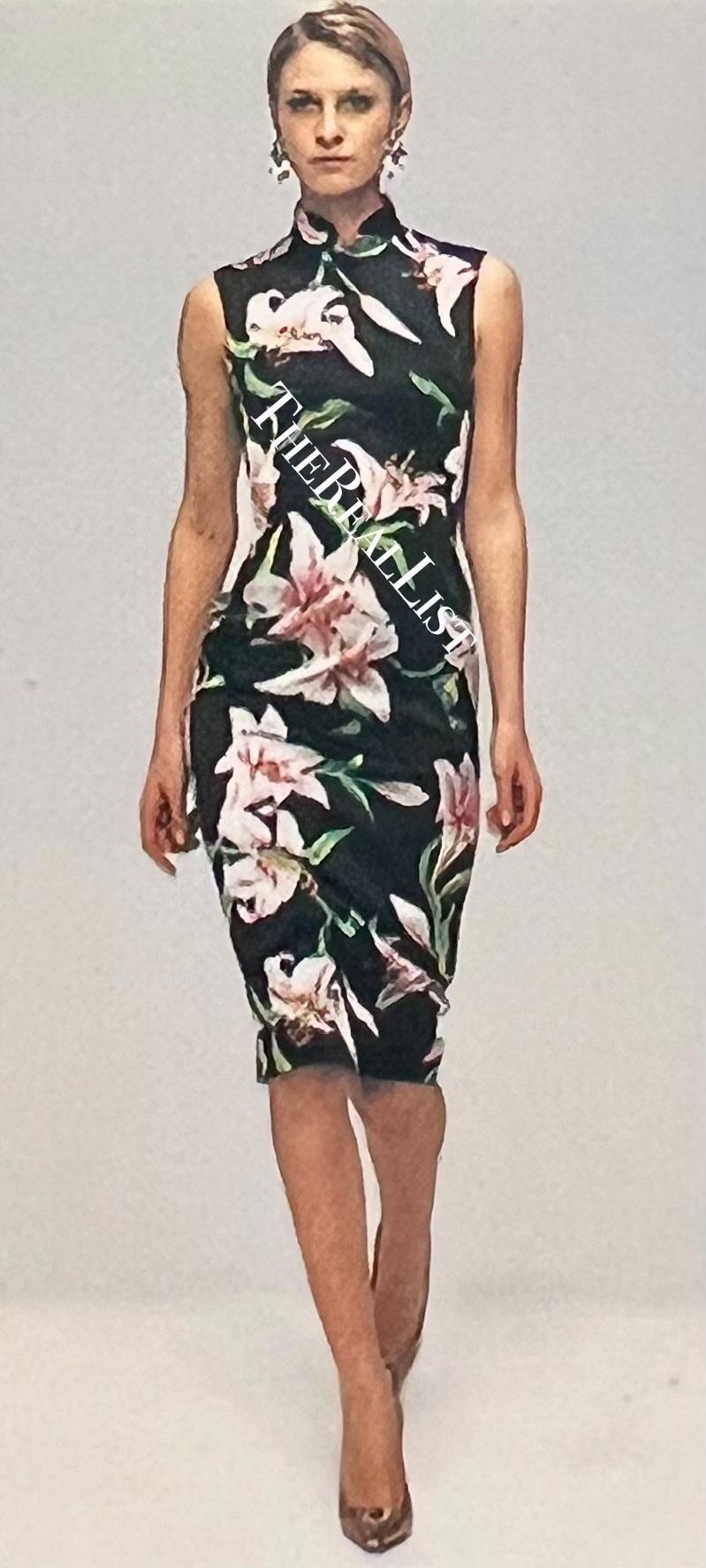 From the Spring/Summer 2001 collection, this lily print Dolce & Gabbana dress debuted on the season's runway. This form-fitting black dress features a standing collar and knee-length hem.

Approximate measurements:
Size - 44IT
Bust: 33 - 42