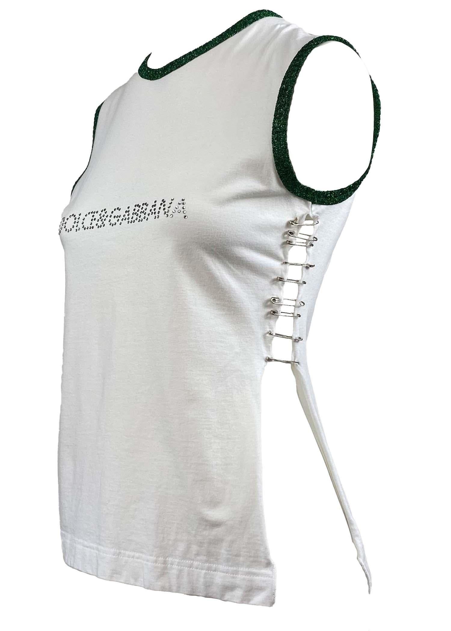 TheRealList presents: a barely-there tank top held together by safety pins hand-placed by Dolce & Gabbana. The green trim around the neck and arms has some lurex sparkle that ties in with the rhinestone logo and shiny metal pins. Part of the S/S