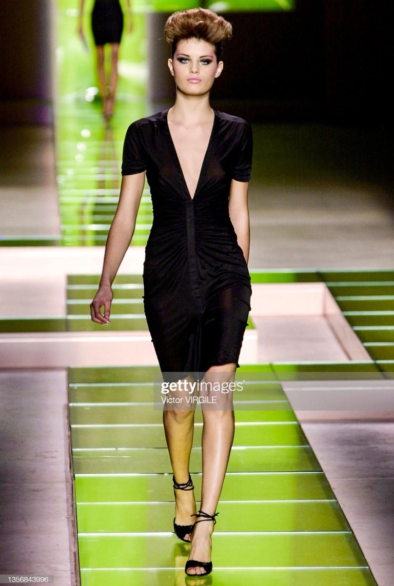 TheRealList presents: an abstract multicolored ruched Gianni Versace dress, designed by Donatella Versace. From the Spring/Summer 2001 collection, this dress debuted on the runway in solid black on look 26 modeled by Isabeli Fontana. This black