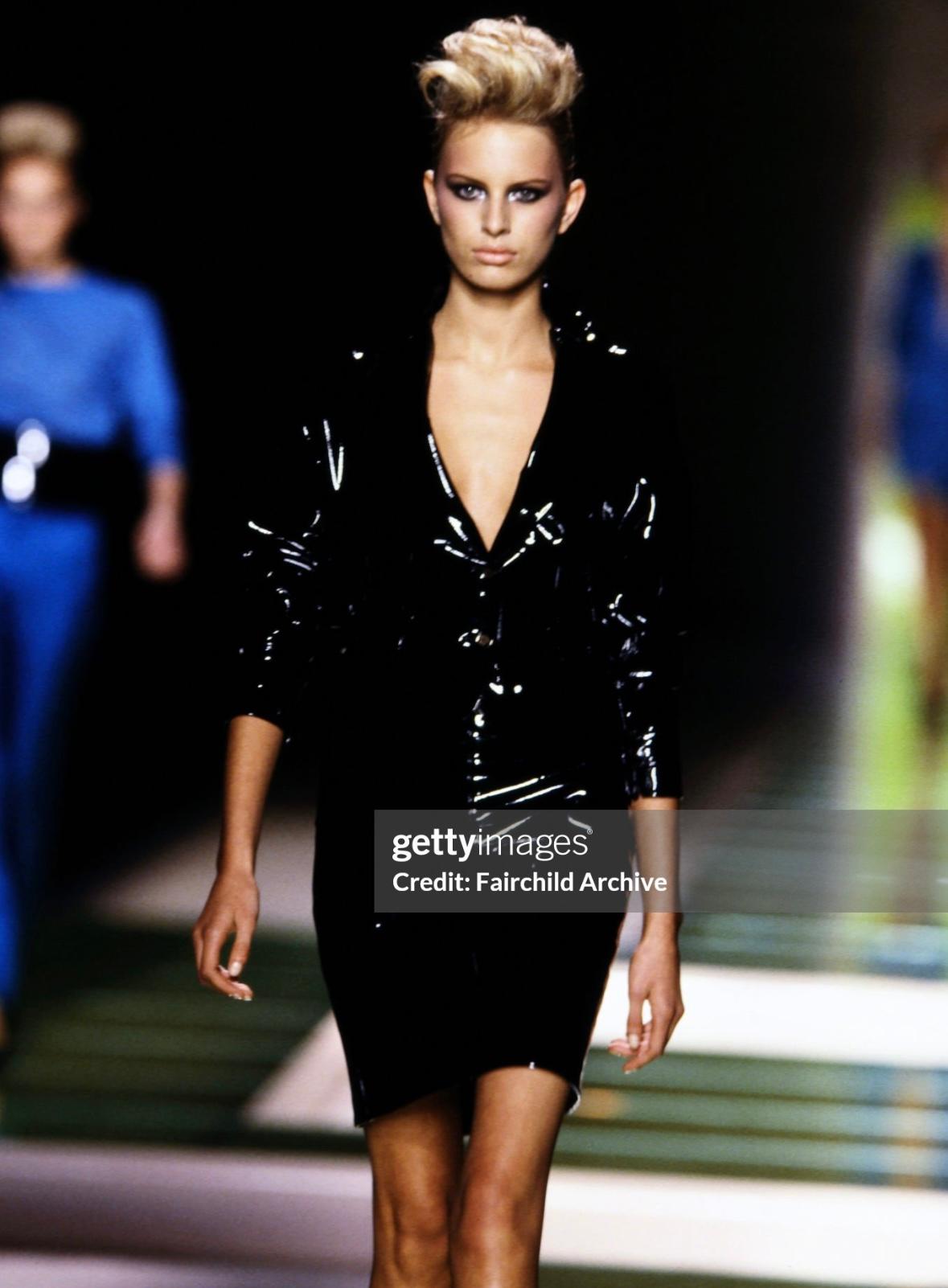 Presenting a fabulous black patent leather Gianni Versace skirt suit, designed by Donatella Versace. From the Spring/Summer 2001 collection, this suit debuted on the season's runway as look 17, modeled by Karolina Kurkova, with the skirt also being