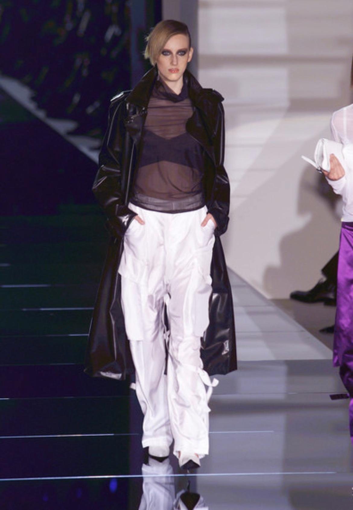 Presenting an incredibly rare leather Gucci bralette, designed by Tom Ford. From the Spring/Summer 2001 collection, the black and white satin versions of this top debuted on the runway on looks 7, 8, 9, 10, 18, 26, 31, and 40. Comprised of two