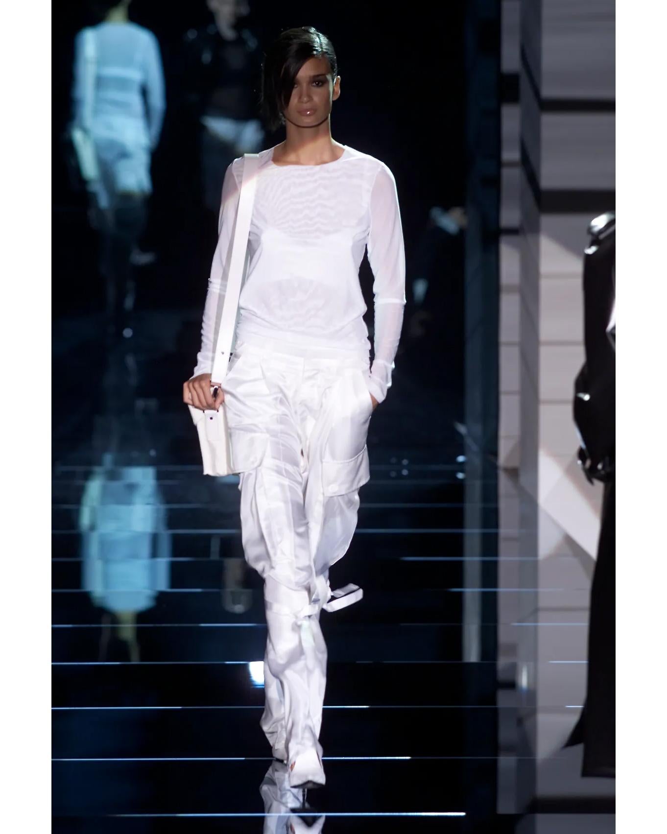 S/S 2001 Gucci by Tom Ford ecru silk side-tie cargo pants. High rise off-white cargo-style trousers with oversized side flap pockets with wrap-around ties. Concealed front button closure, and stamped button closures throughout. Double button closure