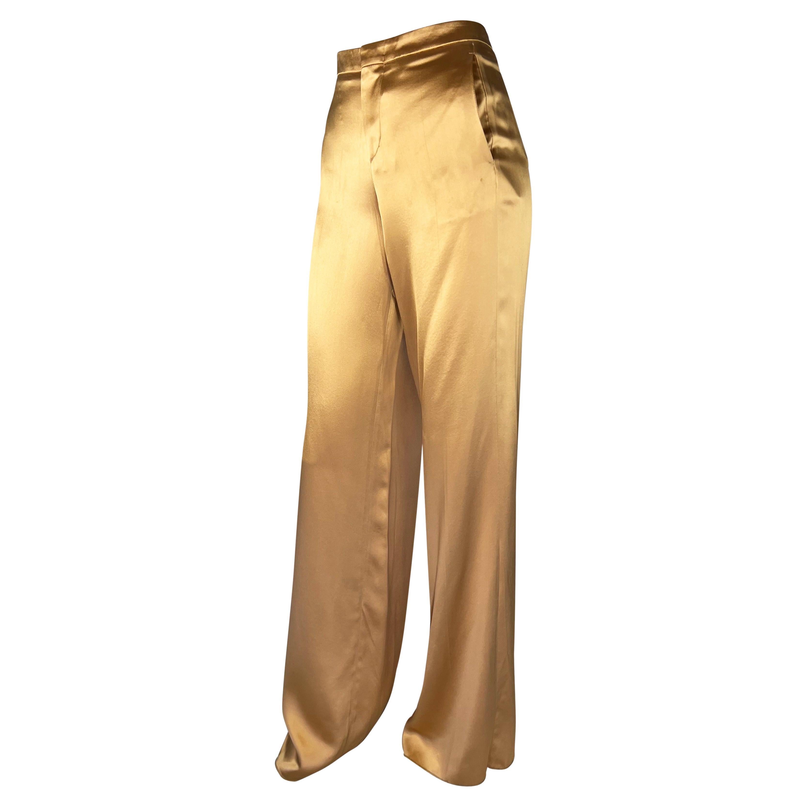 Presenting a luxurious pair of golden silk-blend pants designed by Tom Ford for Gucci's Spring/Summer 2001 collection. The silk and viscose blend and wide-leg construction give these pants a shimmering appearance that beautifully captures light and