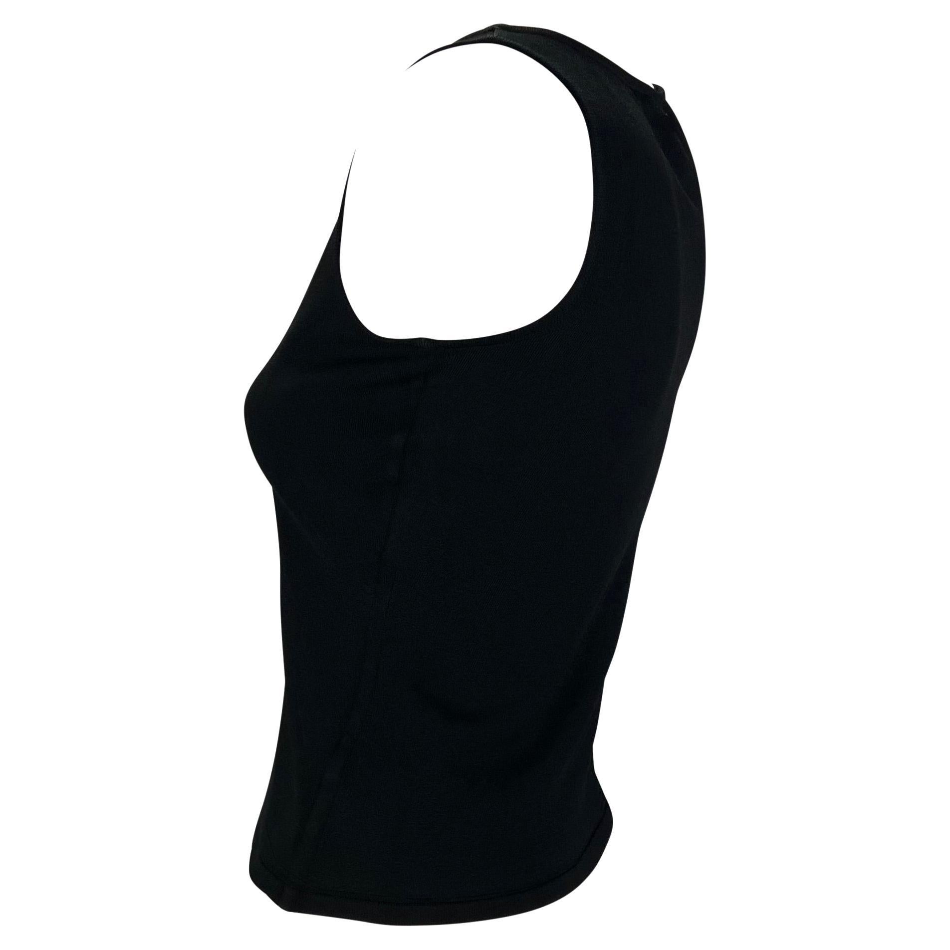 TheRealList presents: a black Gucci tank top, designed by Tom Ford. From the Spring/Summer 2001 collection, this stretchy tank top is made complete with a small 'Gucci' stamped placard just below the nape. Not your average tank top, this top is a