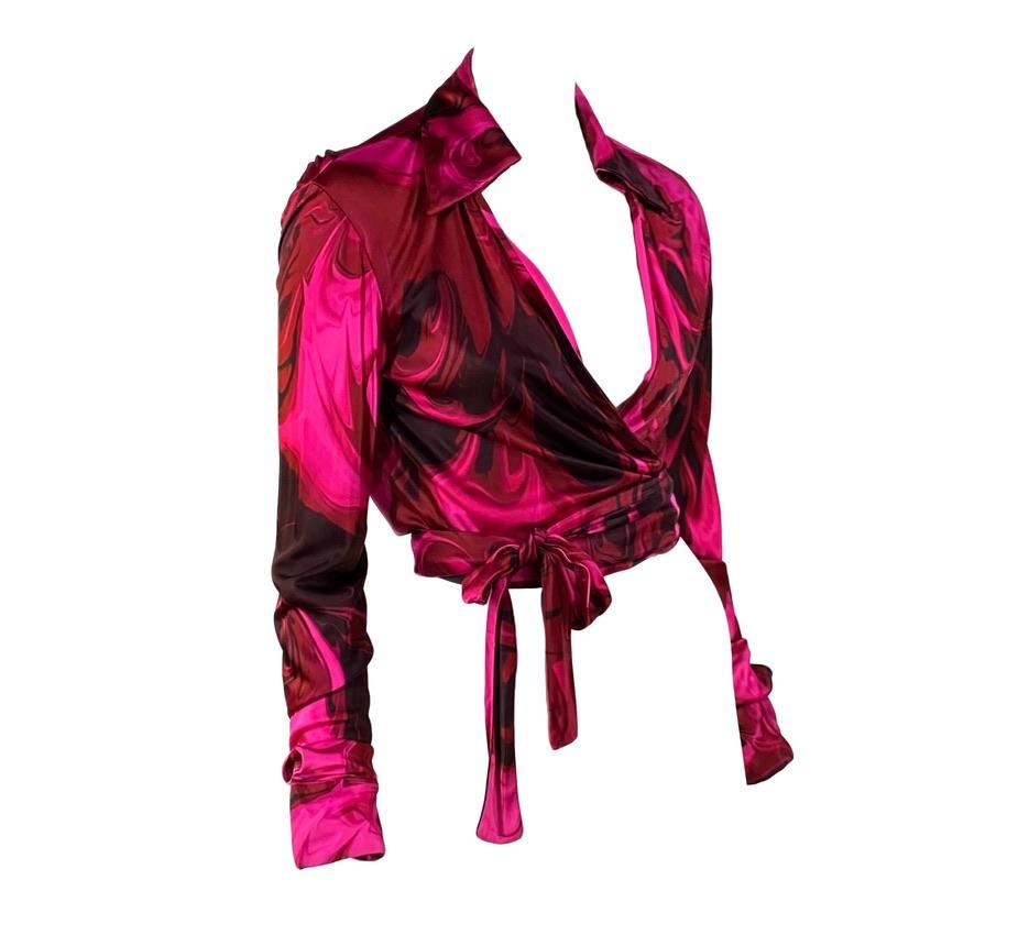 Presenting a stunning pink lava print wrap-around Gucci top designed by Tom Ford. The design debuted on the men's Spring/Summer 2001 runway and was used heavily in womenswear. This print was quite popular, and Kim Cattrall even wore a shirt in this